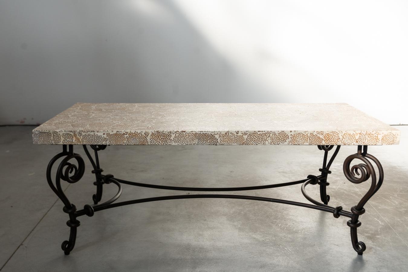 Elite Coffee Table with Termite and Resin Top – 1990s

Add a unique, organic touch to your living space with this striking Elite coffee table from the 1990s, featuring a termite nest and resin top and a beautifully crafted wrought iron base. This