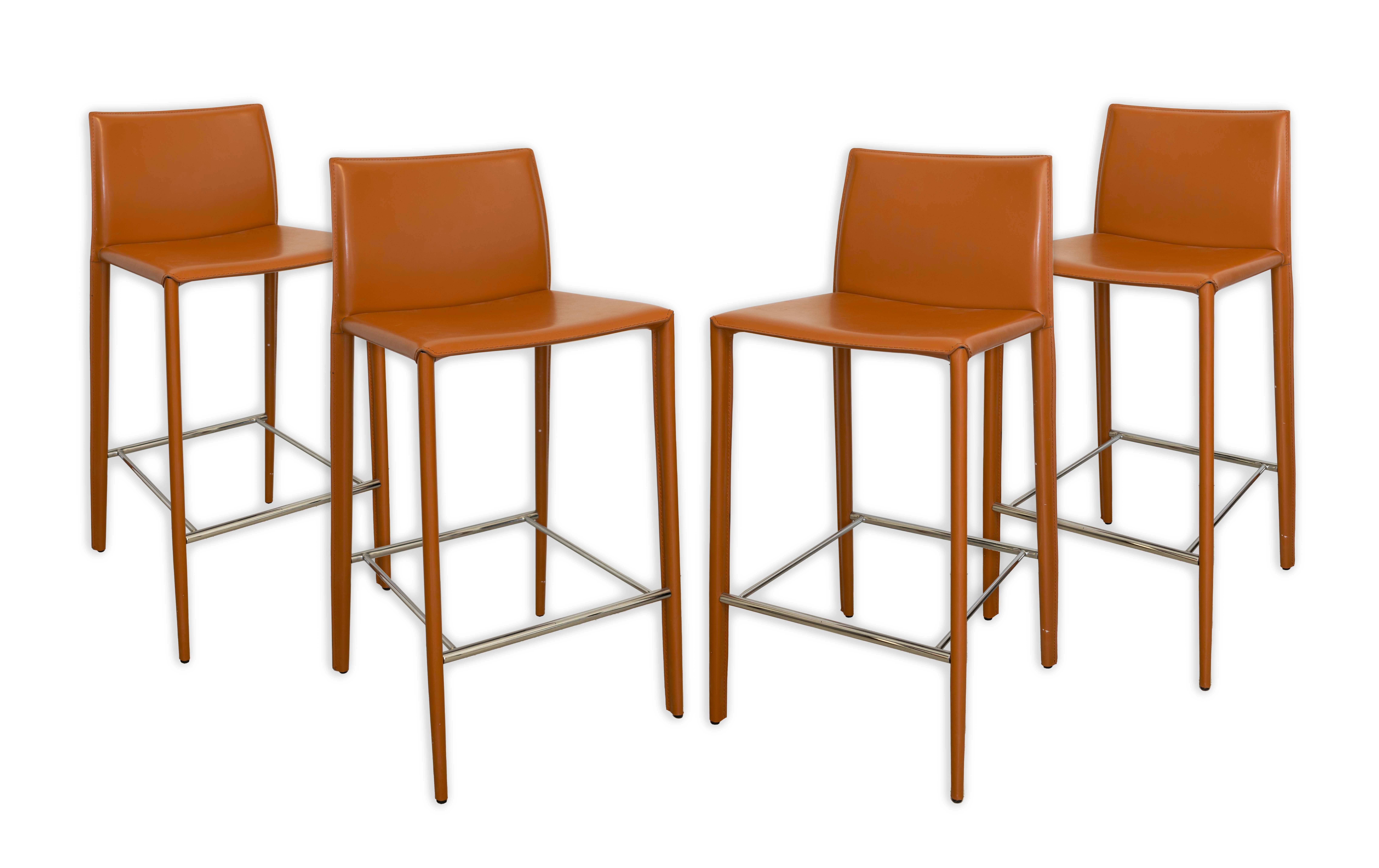 Sophisticated and sleek, the Elite Living Hilton Leather Stitched Bar Stools in a rich cognac hue bring a touch of modern elegance to any space. The contemporary design features clean lines, a comfortable backrest, and durable stitching, making
