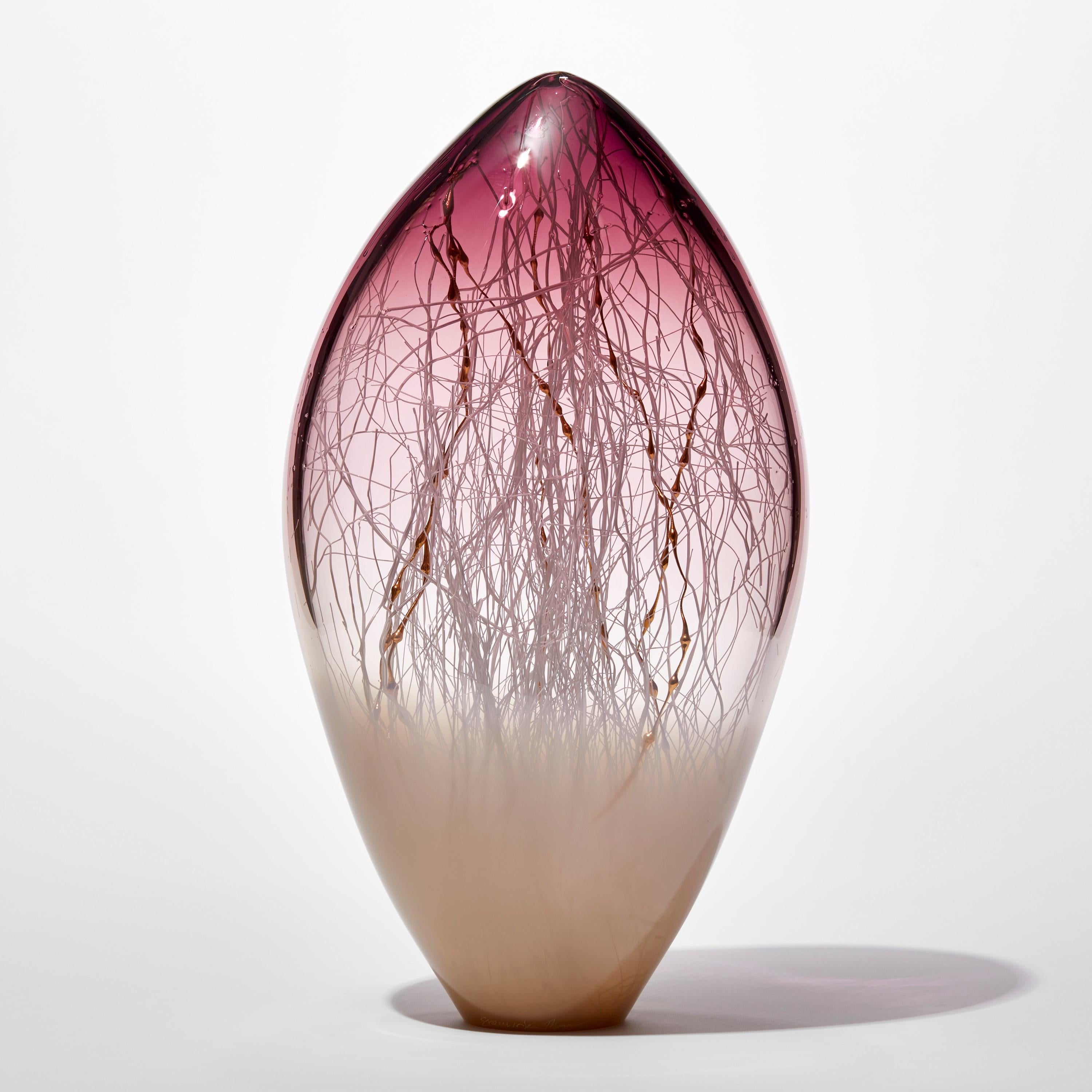 'Elixir in Weimaraner and Amethyst Red' is a unique handblown and sculpted glass artwork by the Danish and British artists, Hanne Enemark & Louis Thompson.

The outer glass form contains a multitude of fine white canes of glass, some of which have