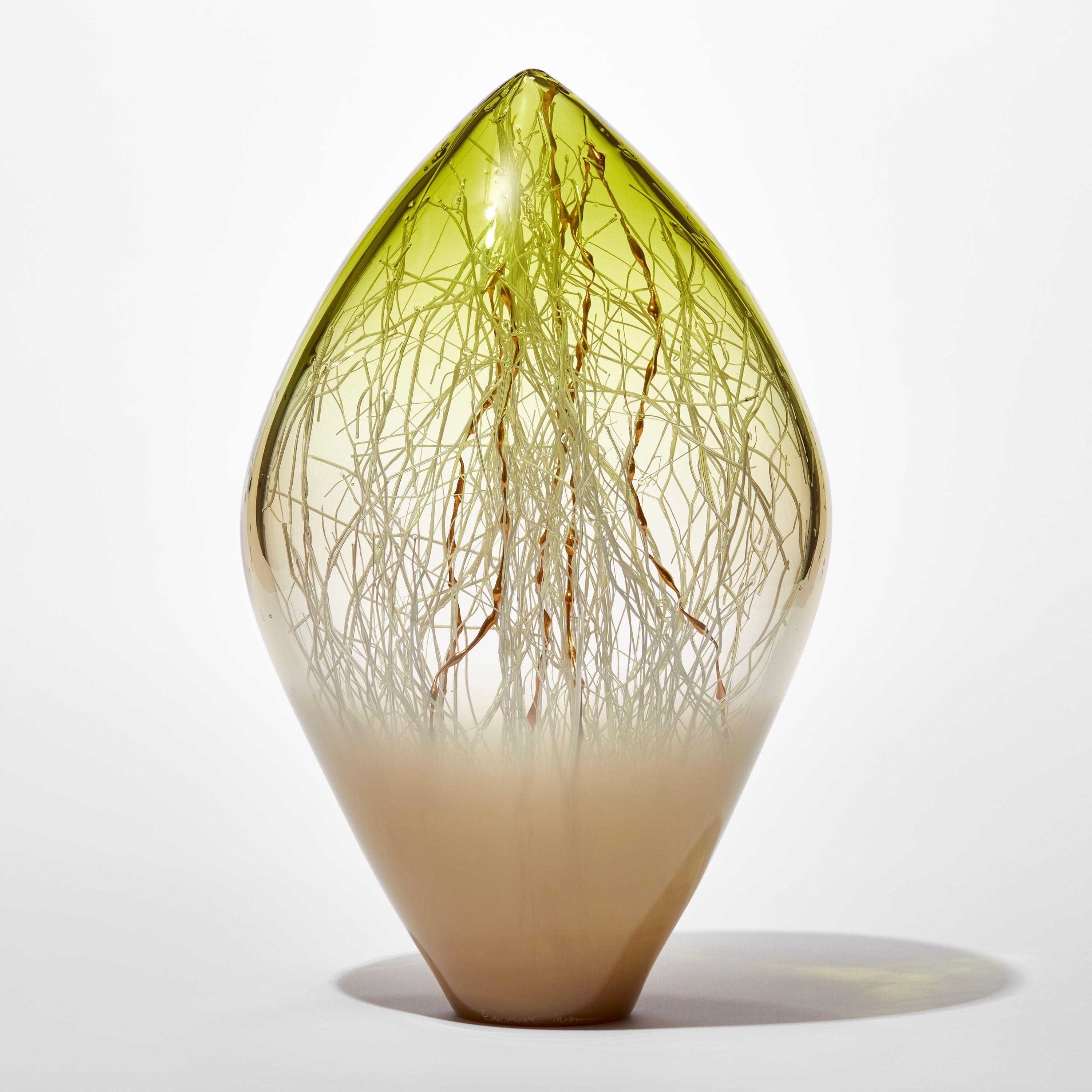 'Elixir in Weimaraner and Olive Green' is a unique handblown and sculpted glass artwork by the Danish and British artists, Hanne Enemark & Louis Thompson.

The outer glass form contains a multitude of fine white canes of glass, some of which have