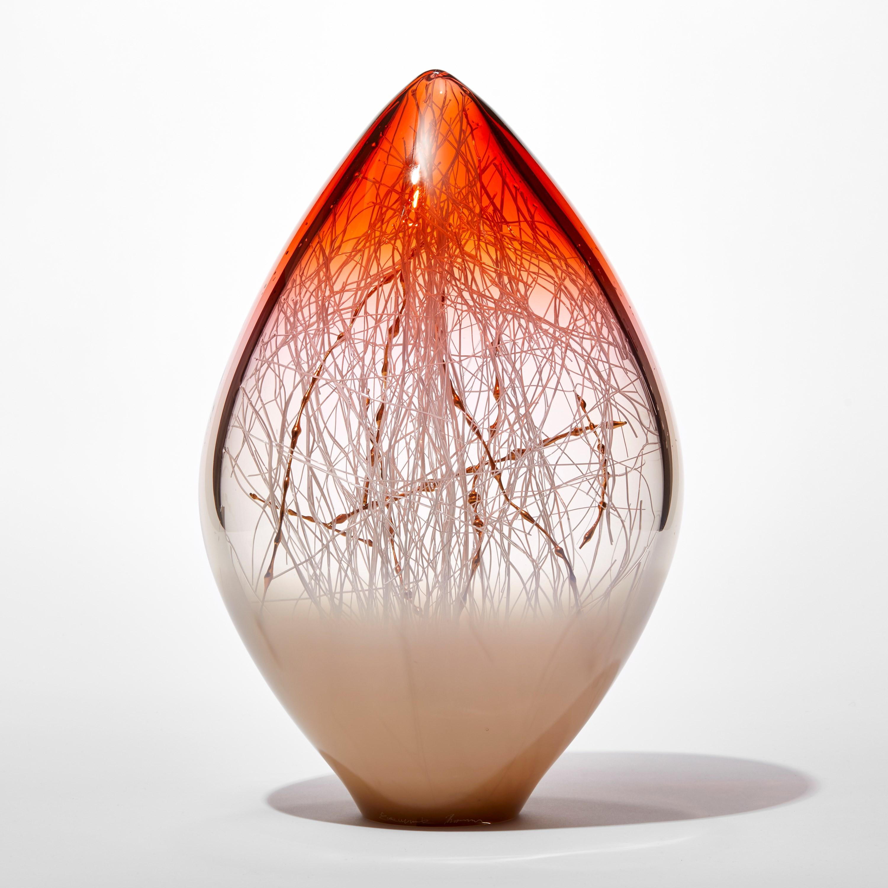 'Elixir in Weimaraner and Sunset Orange' is a unique handblown and sculpted glass artwork by the Danish and British artists, Hanne Enemark & Louis Thompson.

The outer glass form contains a multitude of fine white canes of glass, some of which have