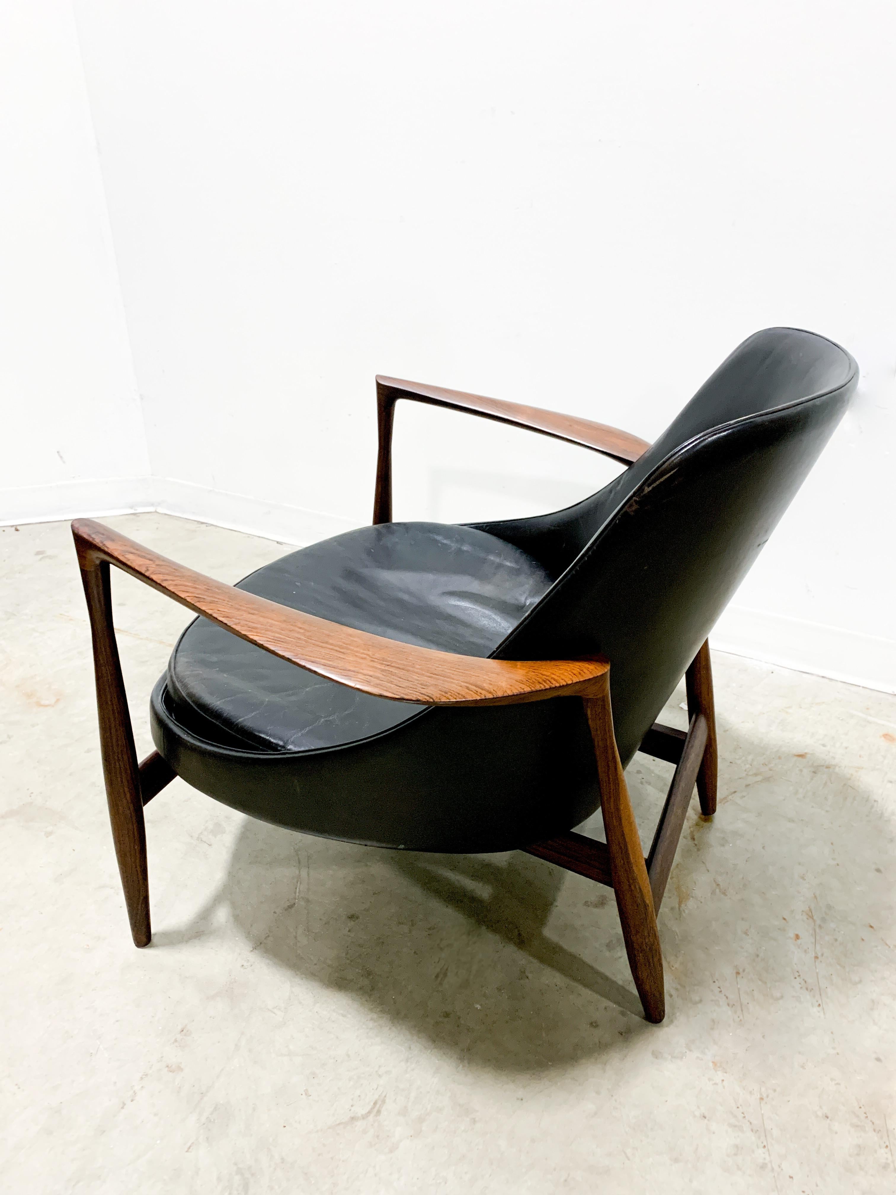 Exquisite and incredibly rare rosewood and leather armchair designed by Ib Kofod-Larsen and made by Christensen and Larsen. Model U56, this chair earned the nickname 'Elizabeth' after Queen Elizabeth II visited Denmark and acquired a pair. The chair