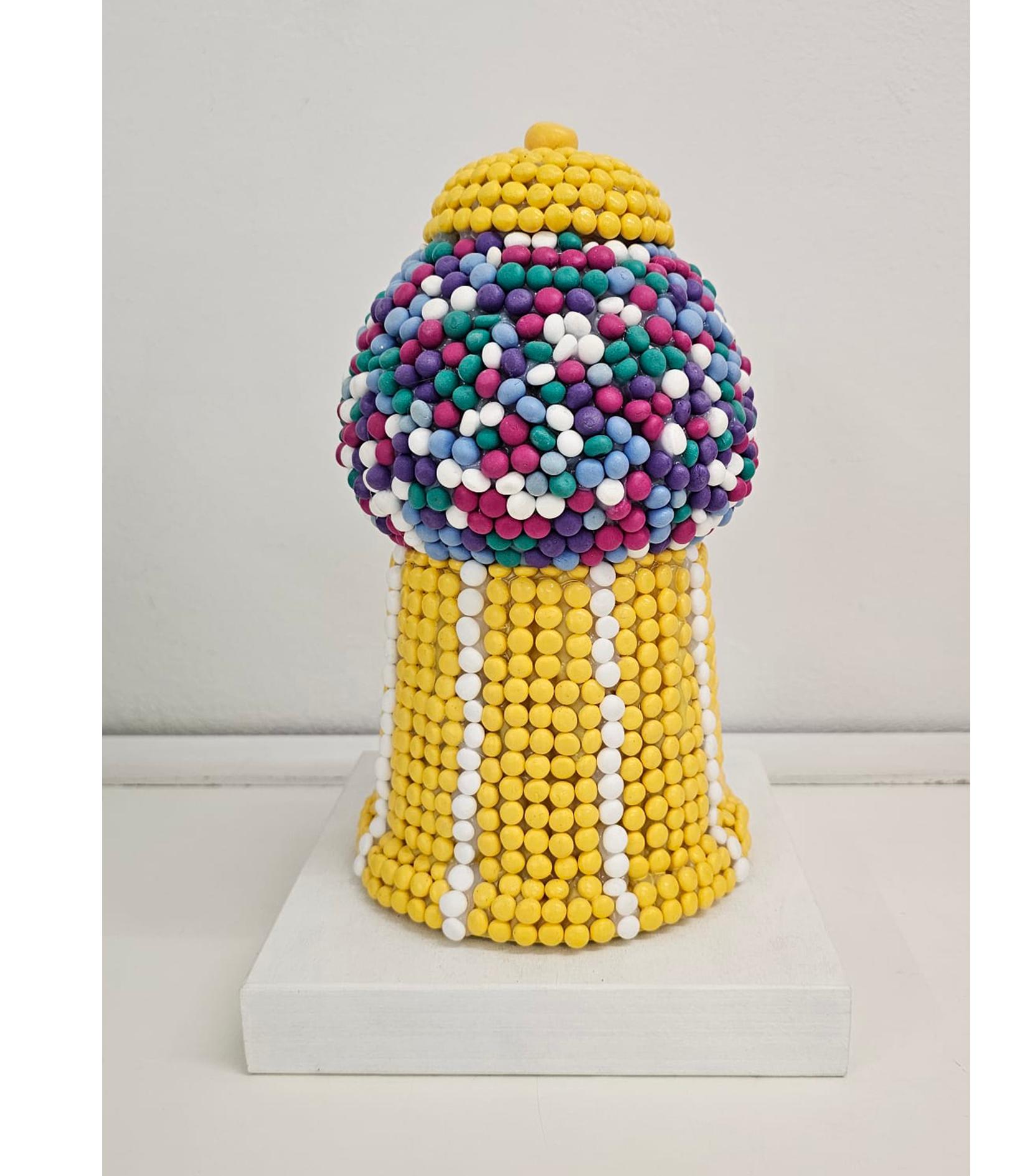 This playful and nostalgic piece from the Fake Candies series captures the spirit of mid-century joy through a hand-modeled 3D gumball machine, composed entirely of colorful clay “candies.” Crafted using natural clay spheres, low-temperature fired