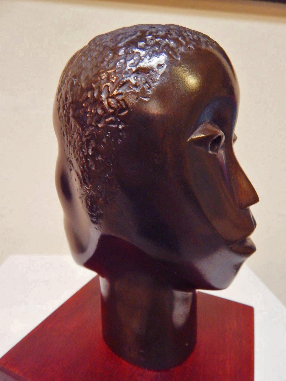 Faces for Two Worlds - Sculpture by Elizabeth Catlett