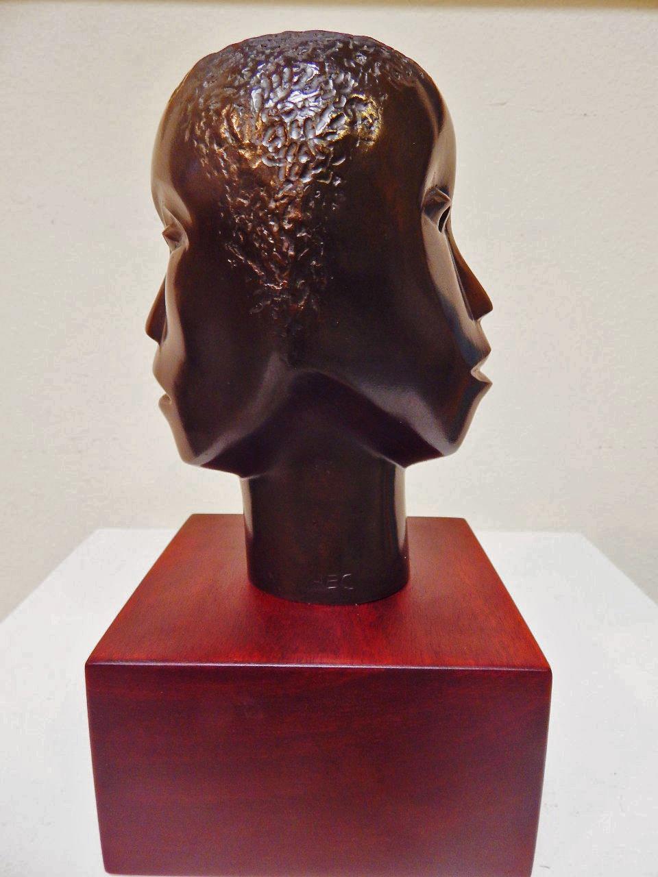 Elizabeth Catlett Figurative Sculpture - Faces for Two Worlds