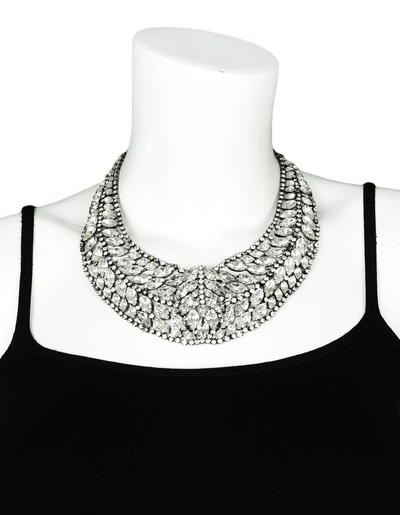 Elizabeth Cole Swarovski Crystal Hematite Plated Bib Necklace

Color: Silver
Materials: Crystalline, Hematite, Metal
Closure/Opening: Push clasp
Overall Condition: Excellent pre-own condition. One crystal in the front left has broken off on one