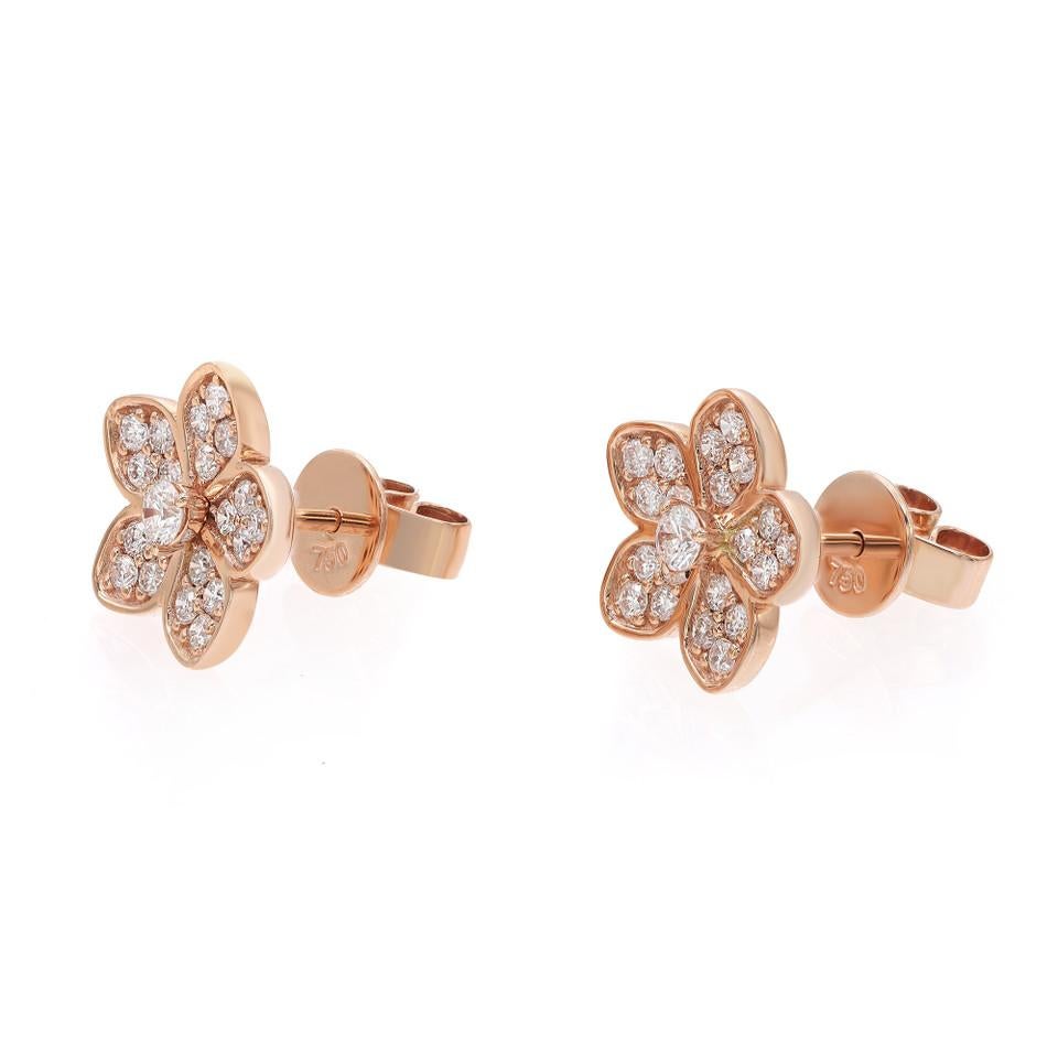 Indulge in the allure of romance with these exquisite romantic floral stud earrings, crafted in 18K rose gold. These earrings are a true embodiment of whimsical beauty, adorned with a pavé setting of sparkling diamonds totaling 0.52 carats. Each