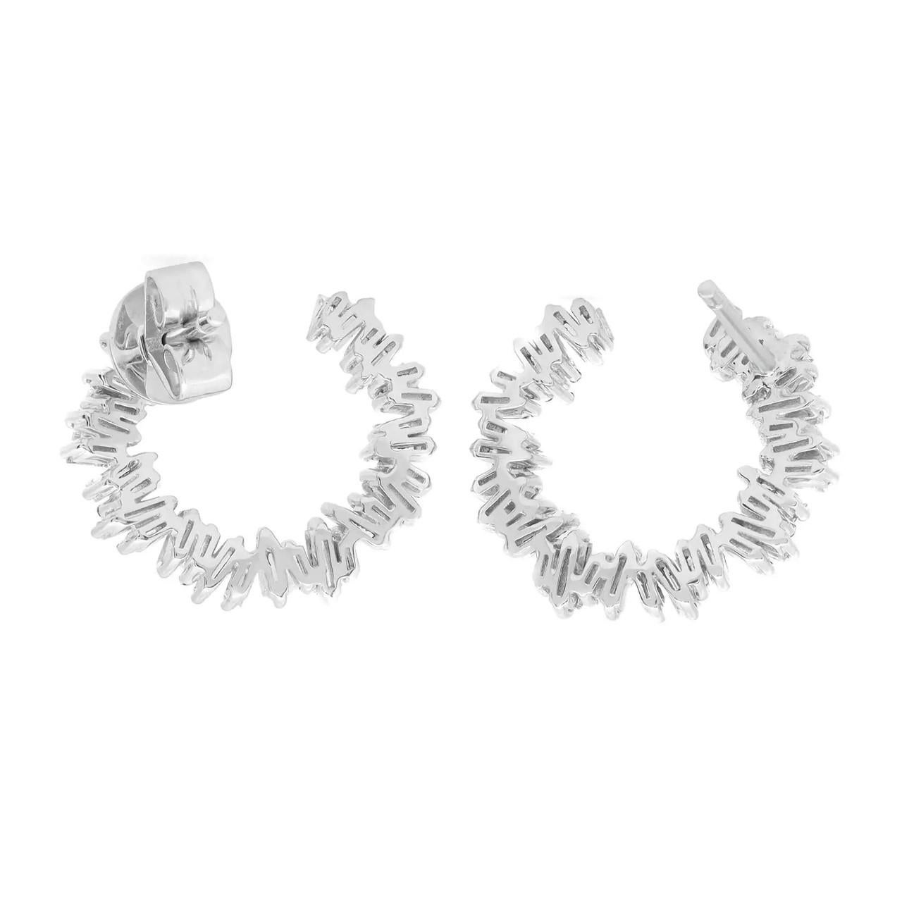 Indulge in timeless elegance with these exquisite C-Shaped Baguette Cut diamond stud earrings, expertly crafted in 18K white gold. The classic design showcases the mesmerizing beauty of baguette-cut diamonds, renowned for their sleek and elongated