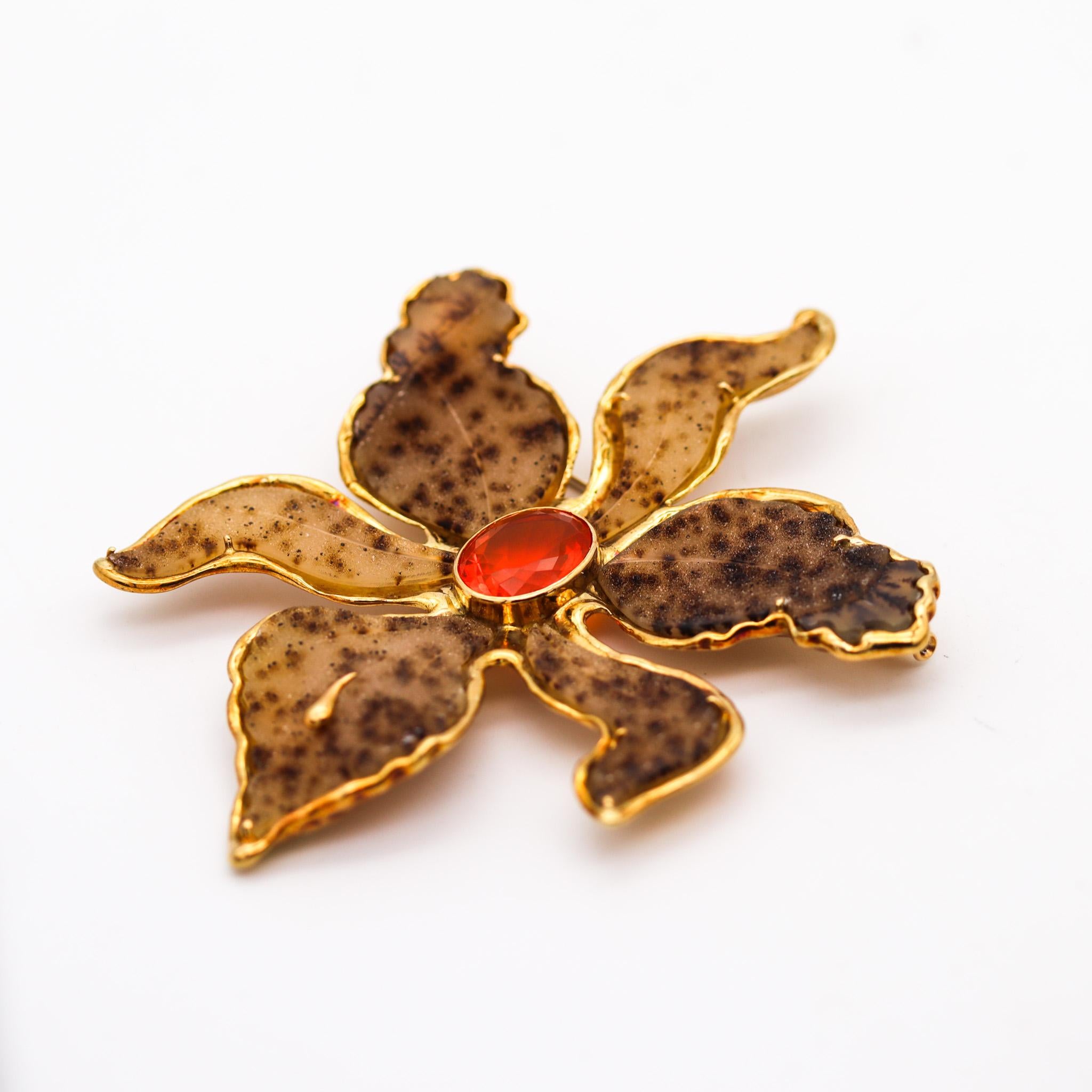 Orchid flower pendant-brooch designed by Elizabeth Gage.

Exceptional pendant-brooch, created in London by the British jewelry designer Elizabeth Gage, back in the 1990. This piece of jewelry is magnificent and has been carefully crafted in the