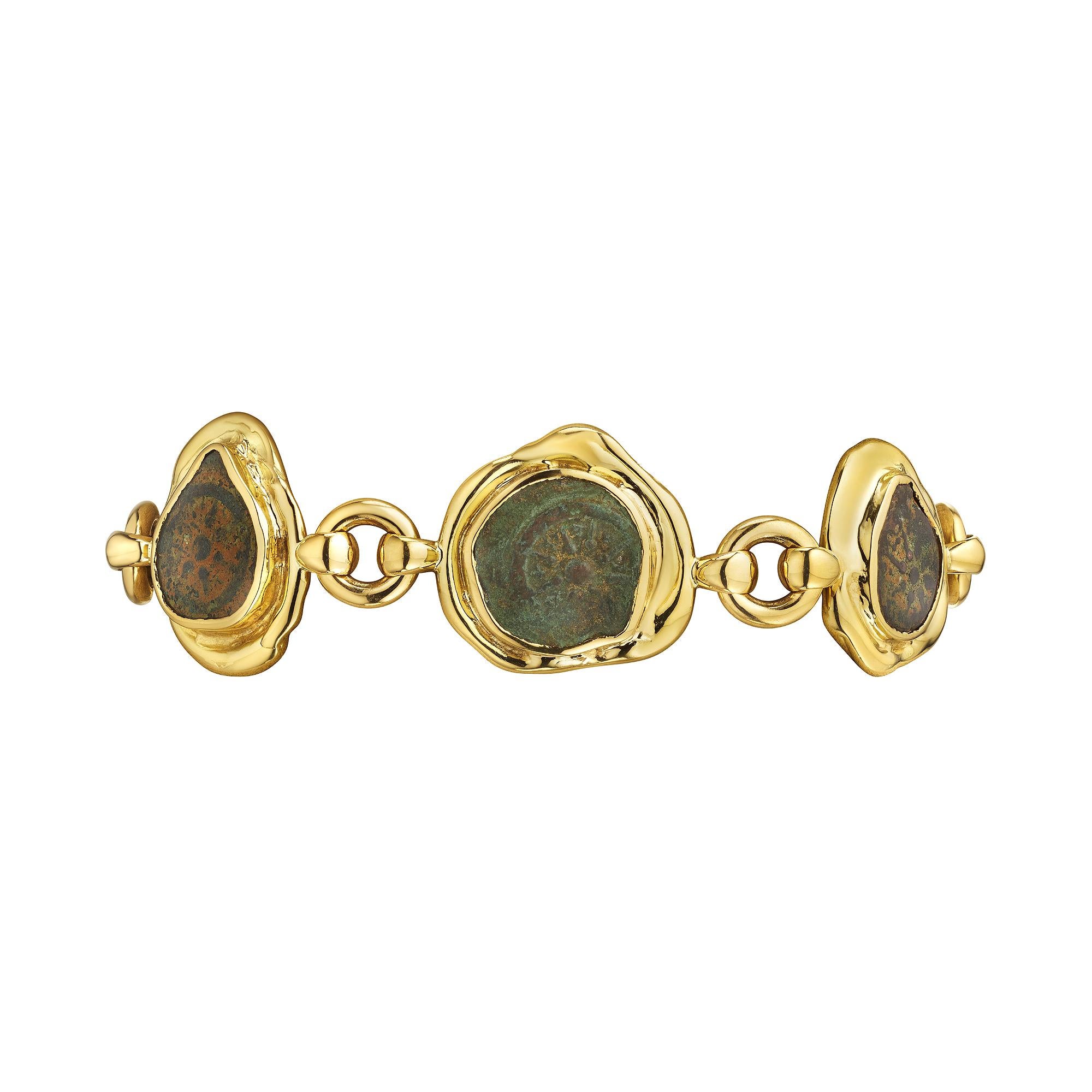 Wear a part of the past with this Elizabeth Gage ancient Hasmonean bronze coin gold link bracelet.  With six ancient coins, dating from 103 to 76 B.C. and organically framed in polished 18 karat yellow gold, this one-of-a-kind link bracelet is the