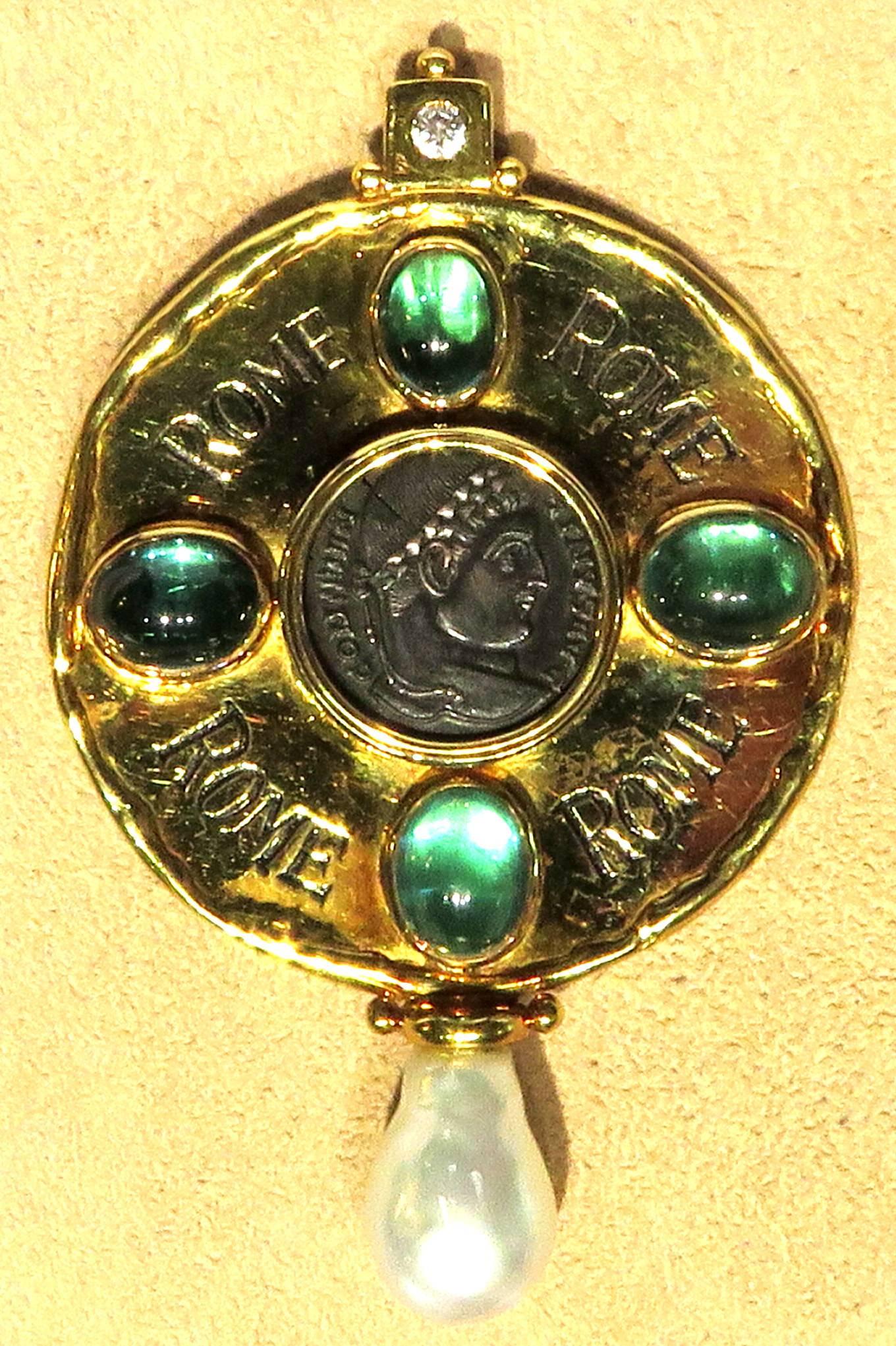 Phenomenal rare large Elizabeth Gage 18 Karat, 4 bezel set green blue tourmaline's, and featuring a Constantine I coin dated 307-337 AD presented in the original box. Pin also has diamond accent and freshwater pearl drop. This pin can easily be worn