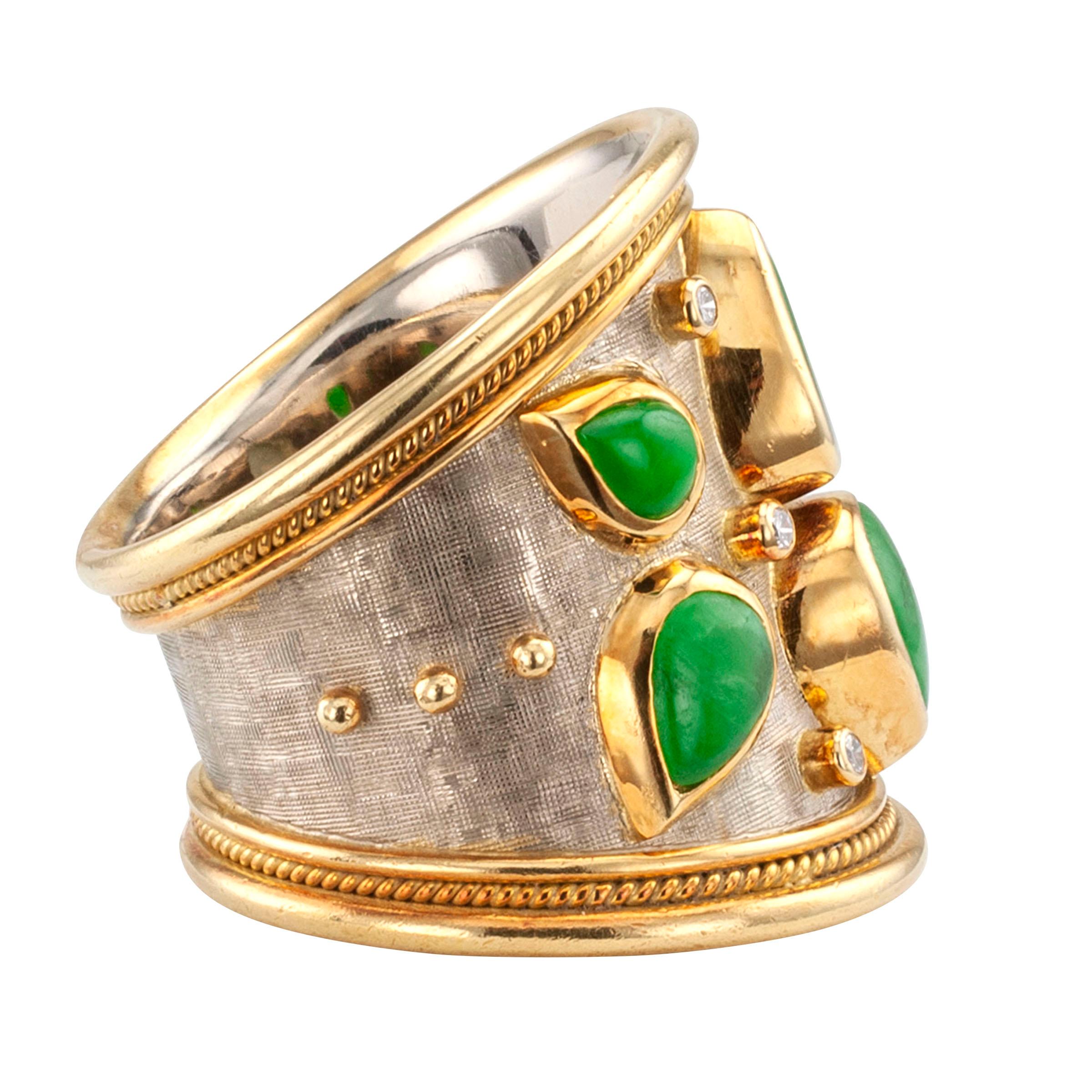 Elizabeth Gage diamond jadeite and gold cigar band ring.

DETAILS:
Elizabeth Gage estate diamond and jadeite cigar band gold ring.
DIAMONDS: six round brilliant-cut totaling approximately 0.09 carat.
GEMSTONES: six green, teardrop-shaped jadeite of