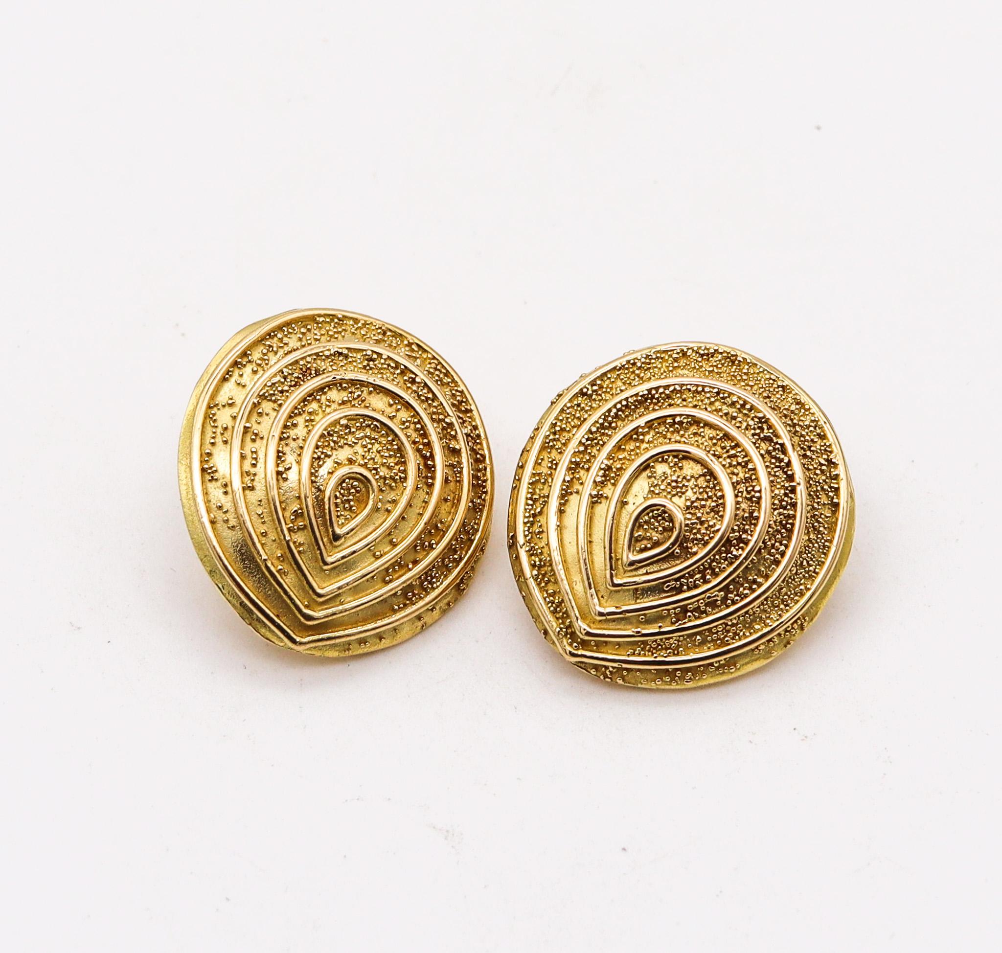 Sculptural pair of earrings designed by Elizabeth Gage.

Beautiful sculptural clip-on earrings, created in London England by the jewelry designer Elizabeth Gage, back in the 1990. These earrings have been made in an ovoid bombe shape, with a pattern