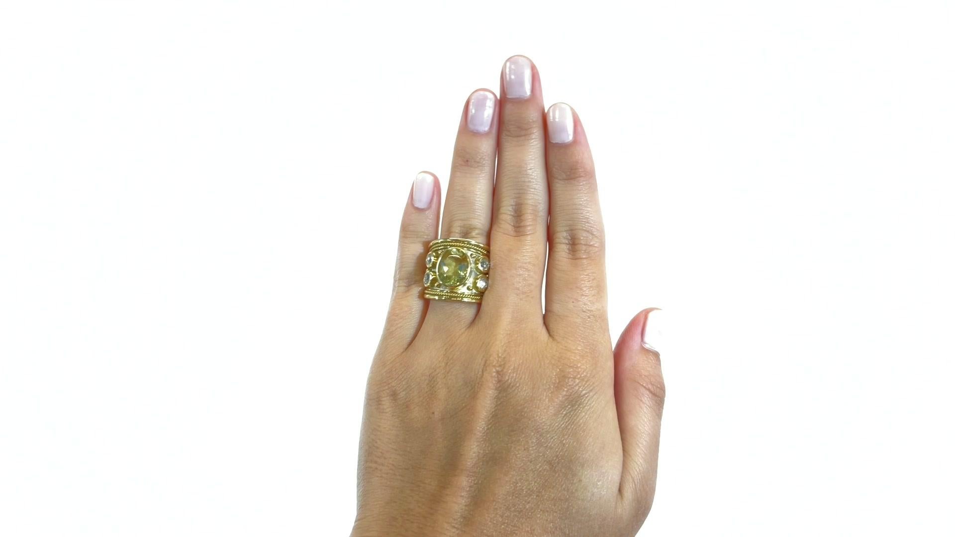 Elizabeth Gage Peridot Diamond 18k Gold Templar Ring. The main gemstone is an oval peridot approximately 4.00 carats. Accompanied by 4 Old European Cut diamond approximately 1.00 carat total, F-G color, VS clarity. Signed Gage with maker's mark.