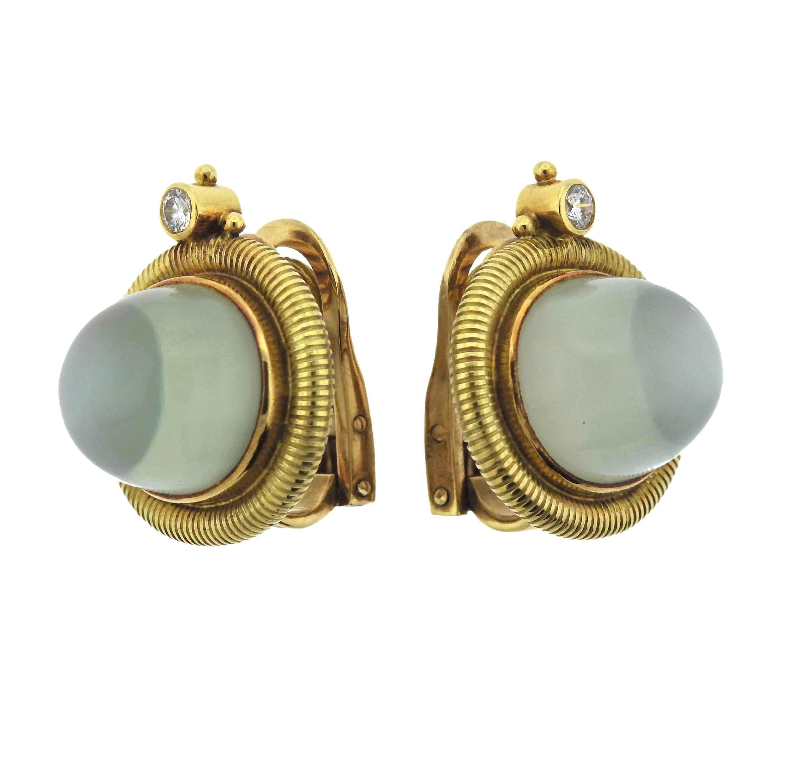  Pair of 18k gold Elizabeth Gage earrings, set with Aquamarine cabochons - 14.6mm x 12.5mm, backed with mother of pearl , adorned with approx. 0.18ctw in G/VS diamonds. Earrings are 20mm x 22mm, weigh 24.5 grams. Marked: Gage, English mark.