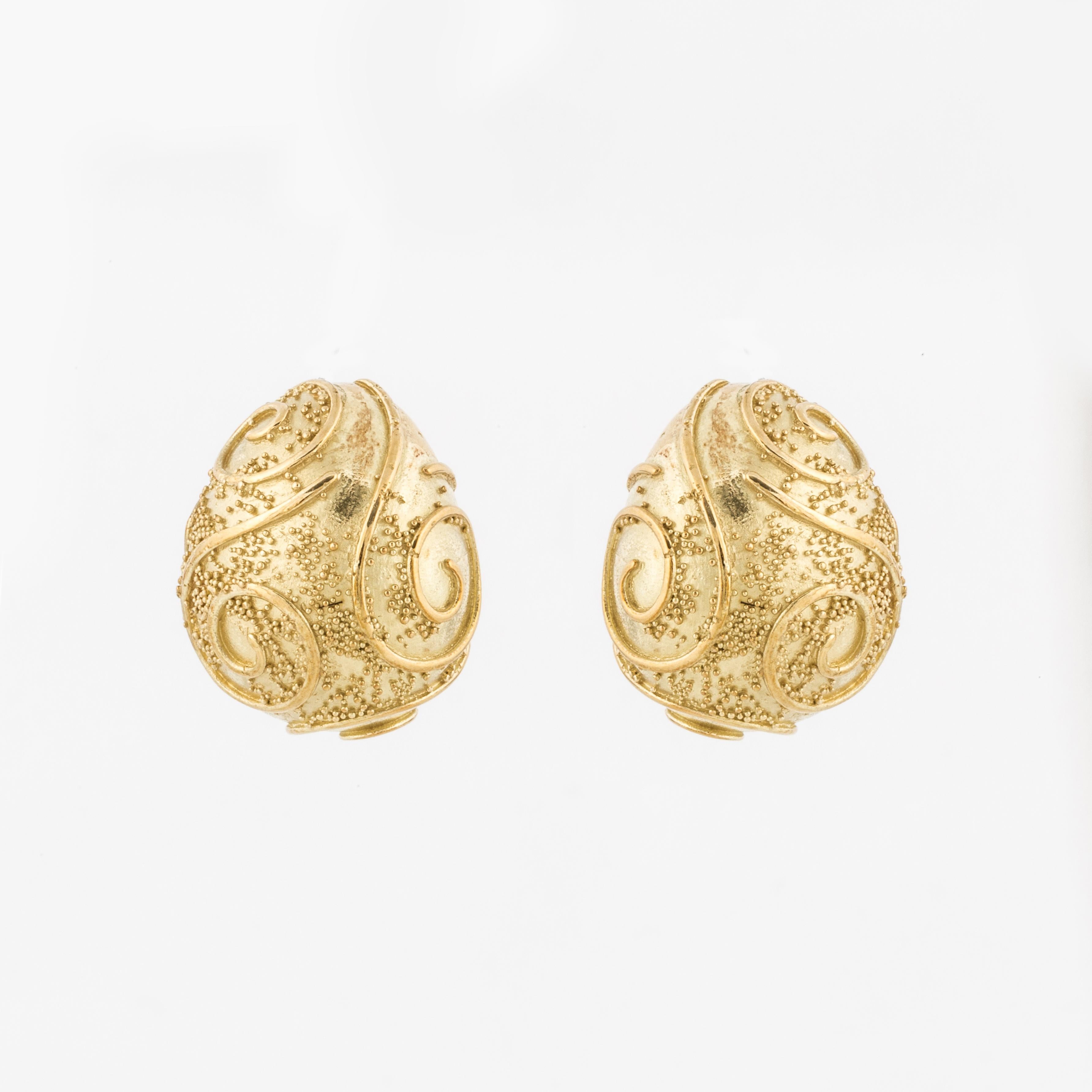 Elizabeth Gage San Marco earrings in 18K yellow gold.  Measure 1 inch long, 3/4 inches wide and stand 1/2 inch off the ear.  Earrings are clip backs.