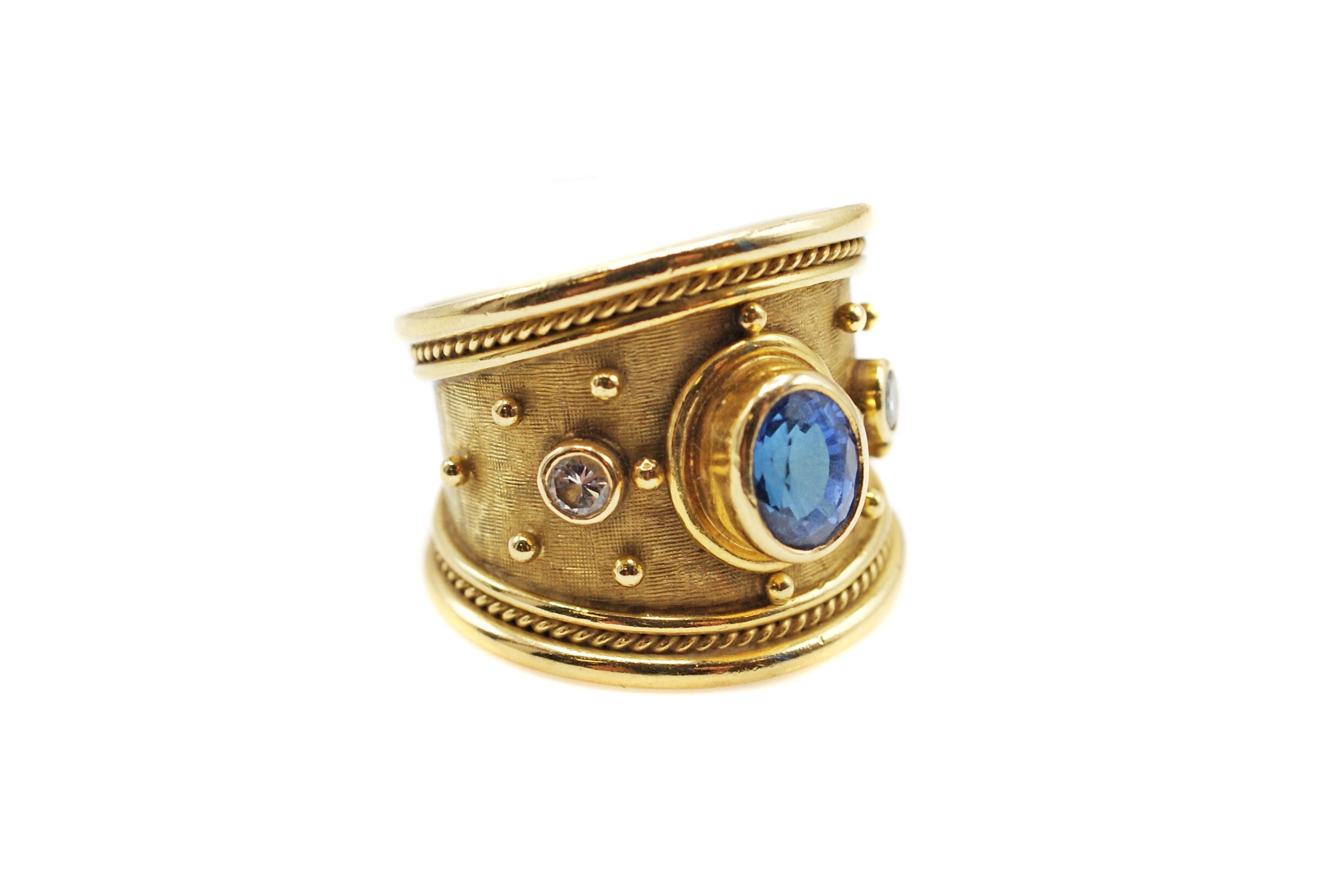 Wonderful 18 karat yellow gold Templar Ring by Elizabeth Gage. This chic trademark ring which measures approximately 0.69 inches in length down the finger and graduates comfortable to 0.37 inches at the base of the finger is designed with two