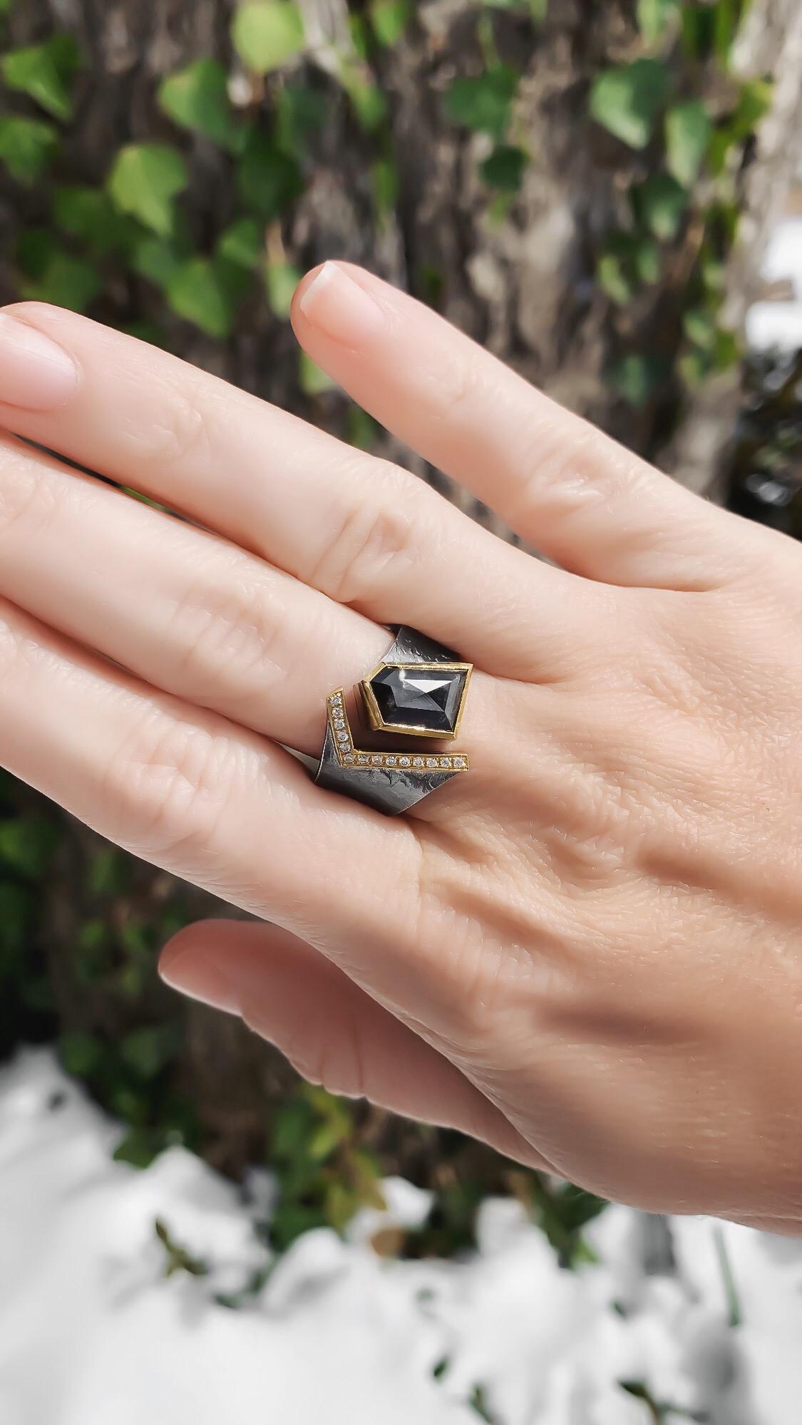 One of a Kind Cyclone Ring handmade by jewelry artist Elizabeth Garvin featuring a spectacular natural 1.23 carat rose-cut black diamond shield and 0.097 total carats of round brilliant-cut white diamonds, all set in 18k yellow gold and seamlessly