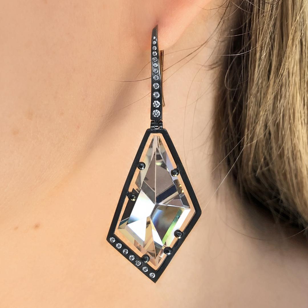 Facets Drop Earrings handmade by jewelry maker Elizabeth Garvin in oxidized sterling silver (on 18k yellow gold ear wires) showcasing a matched pair of custom-cut and faceted prismatic rock crystal gems and round brilliant-cut white diamond accents