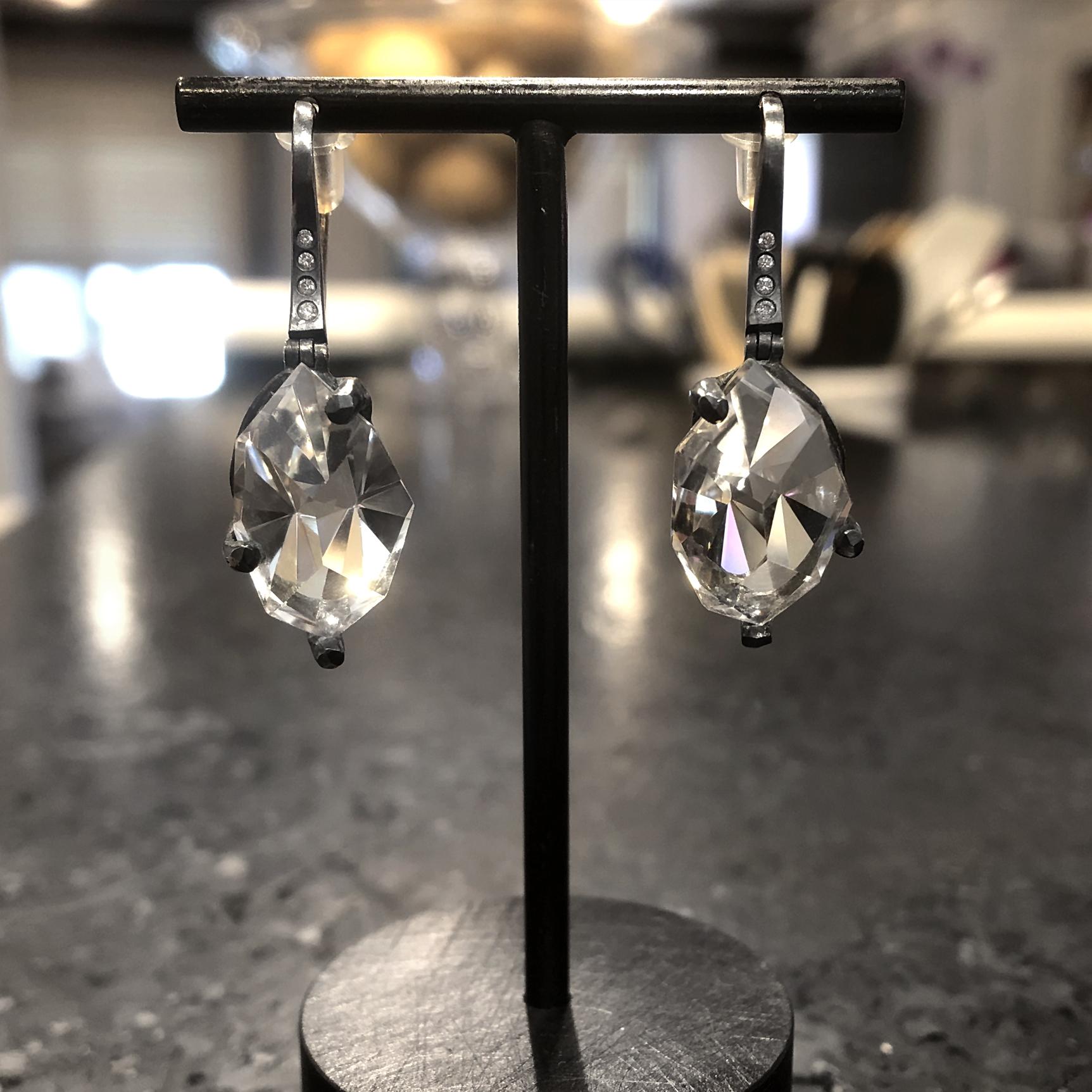 Prism Facet Drop Earrings hand-fabricated by jewelry maker Elizabeth Garvin in oxidized sterling silver (on 18k yellow gold ear wires) featuring a matched pair of custom-cut and faceted prismatic rock crystal gems totaling 15.35 carats and accented