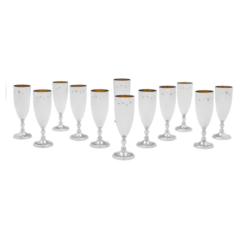 Elizabeth II Period Set of 12 Sterling Silver Champagne Flutes by