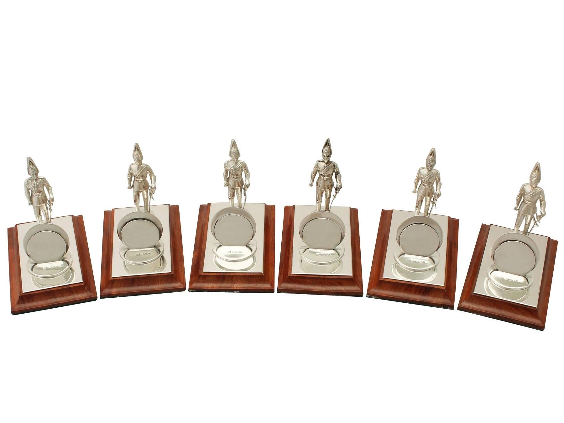 An exceptional, fine and impressive set of six vintage Elizabeth II English sterling silver and wood menu holders with military interest; an addition to our dining silverware collection.

These exceptional vintage Elizabeth II sterling silver menu