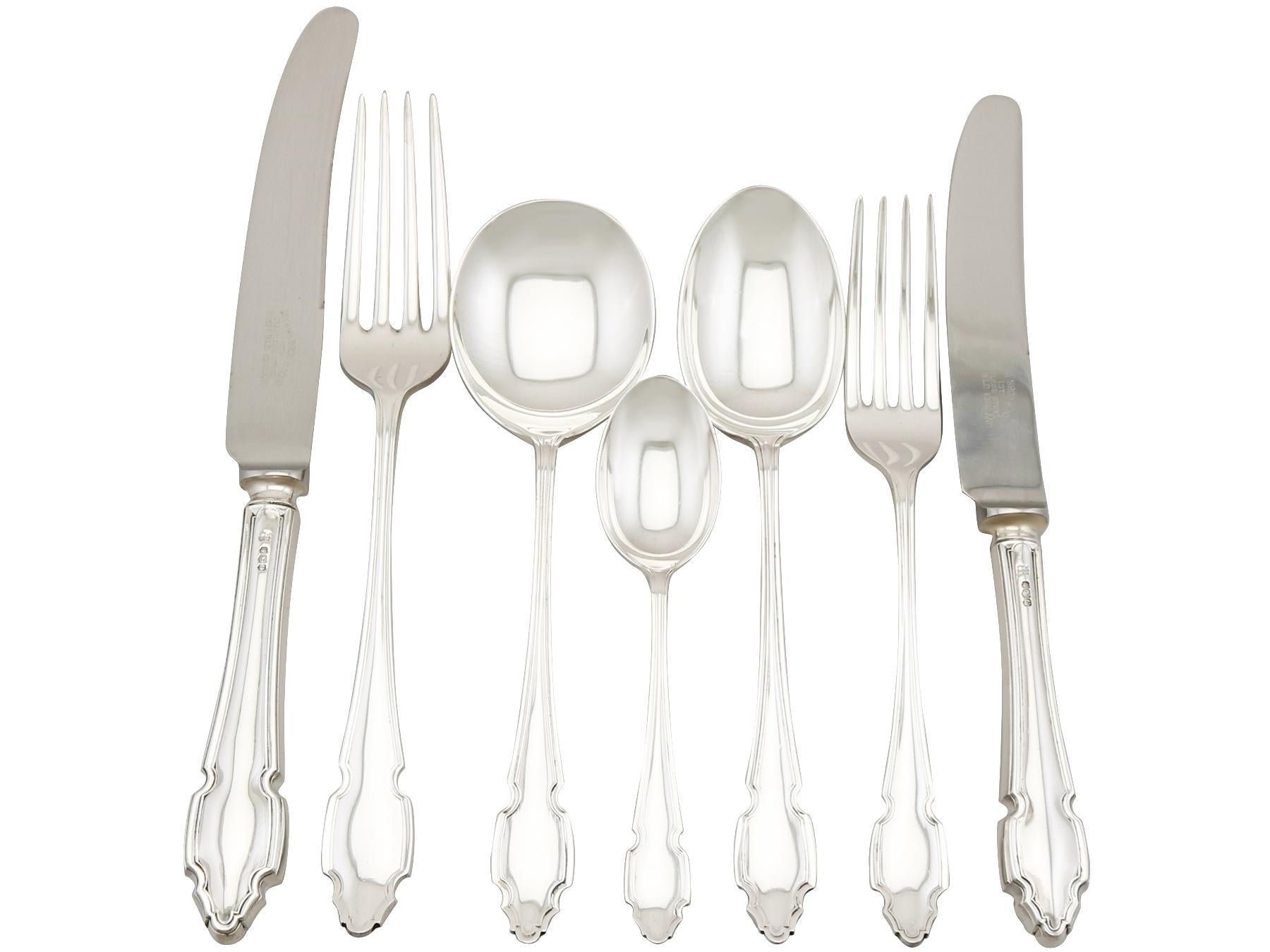 An exceptional, fine and impressive vintage Elizabeth II English sterling silver straight Dubarry I pattern canteen of cutlery for six persons made by Cooper Brothers & Sons Ltd; an addition to our antique flatware sets.

The pieces of this
