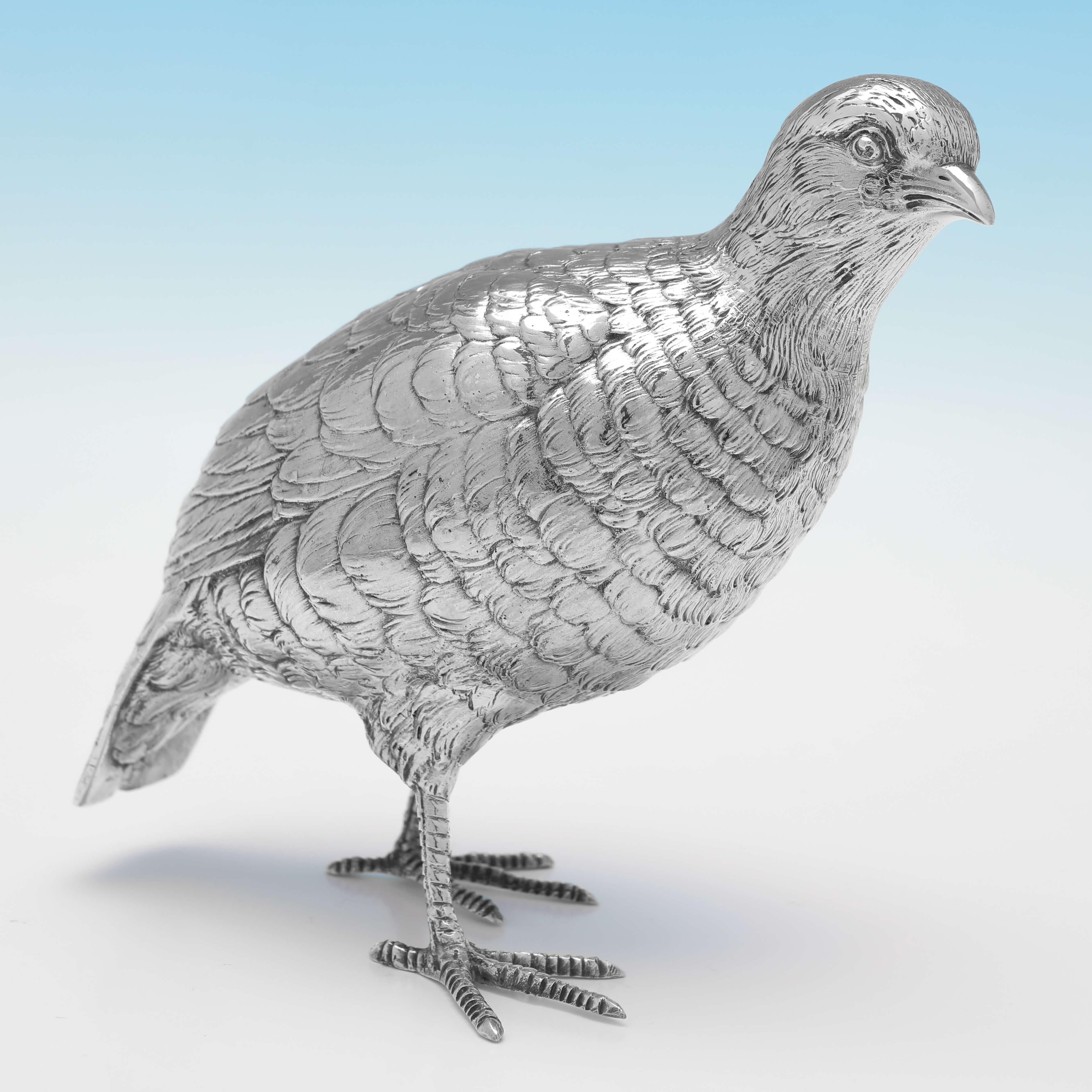 Hallmarked in London in 1960 by Edward Barnard & Sons, this handsome pair of Sterling Silver Models of Partridges, are realistically cast. The male measures 6