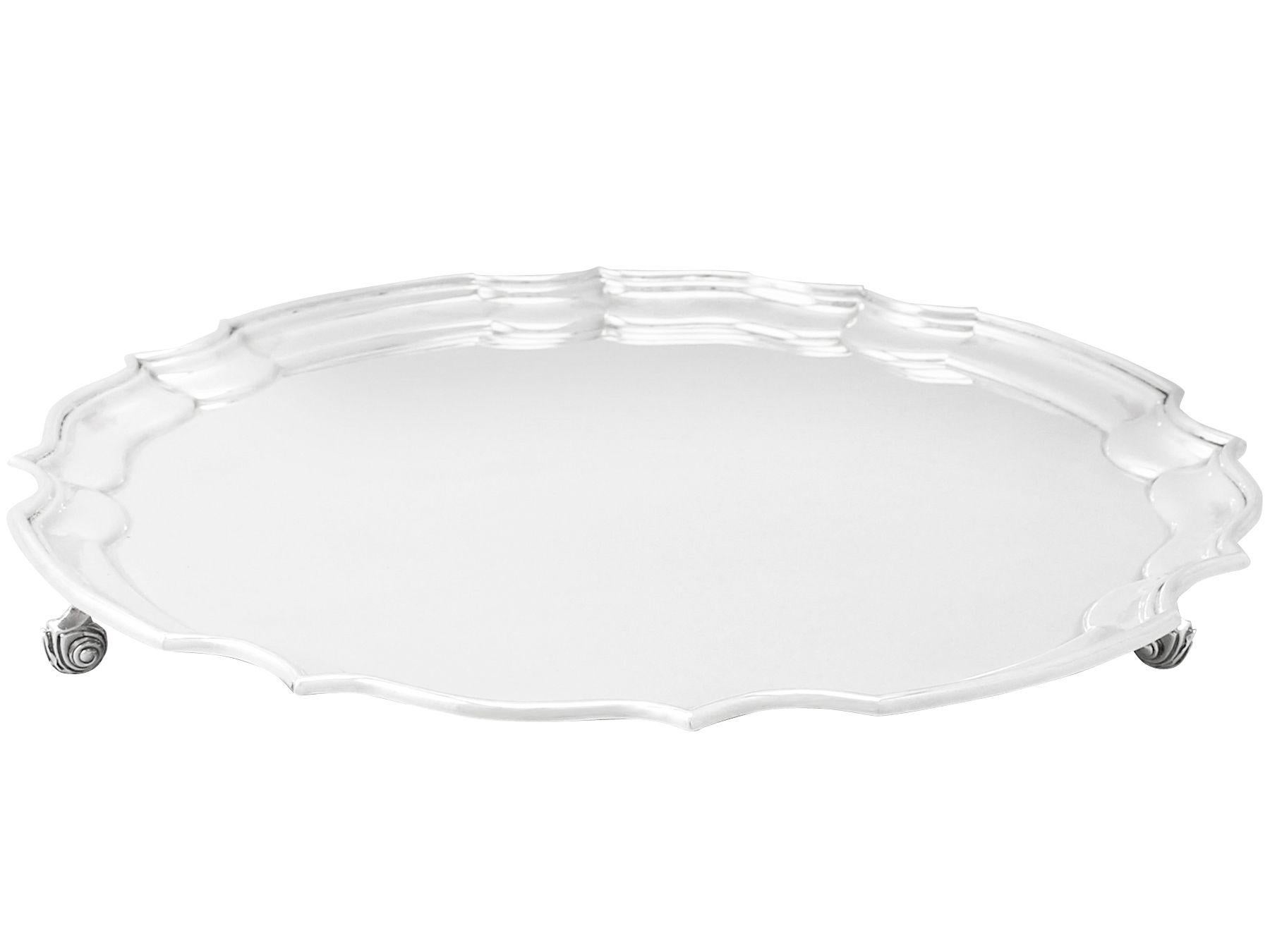 A fine and impressive vintage Elizabeth II English sterling silver salver, an addition to our silver dining collection

This fine vintage Elizabeth II English sterling silver salver has a circular shaped form onto three feet.

The surface of this