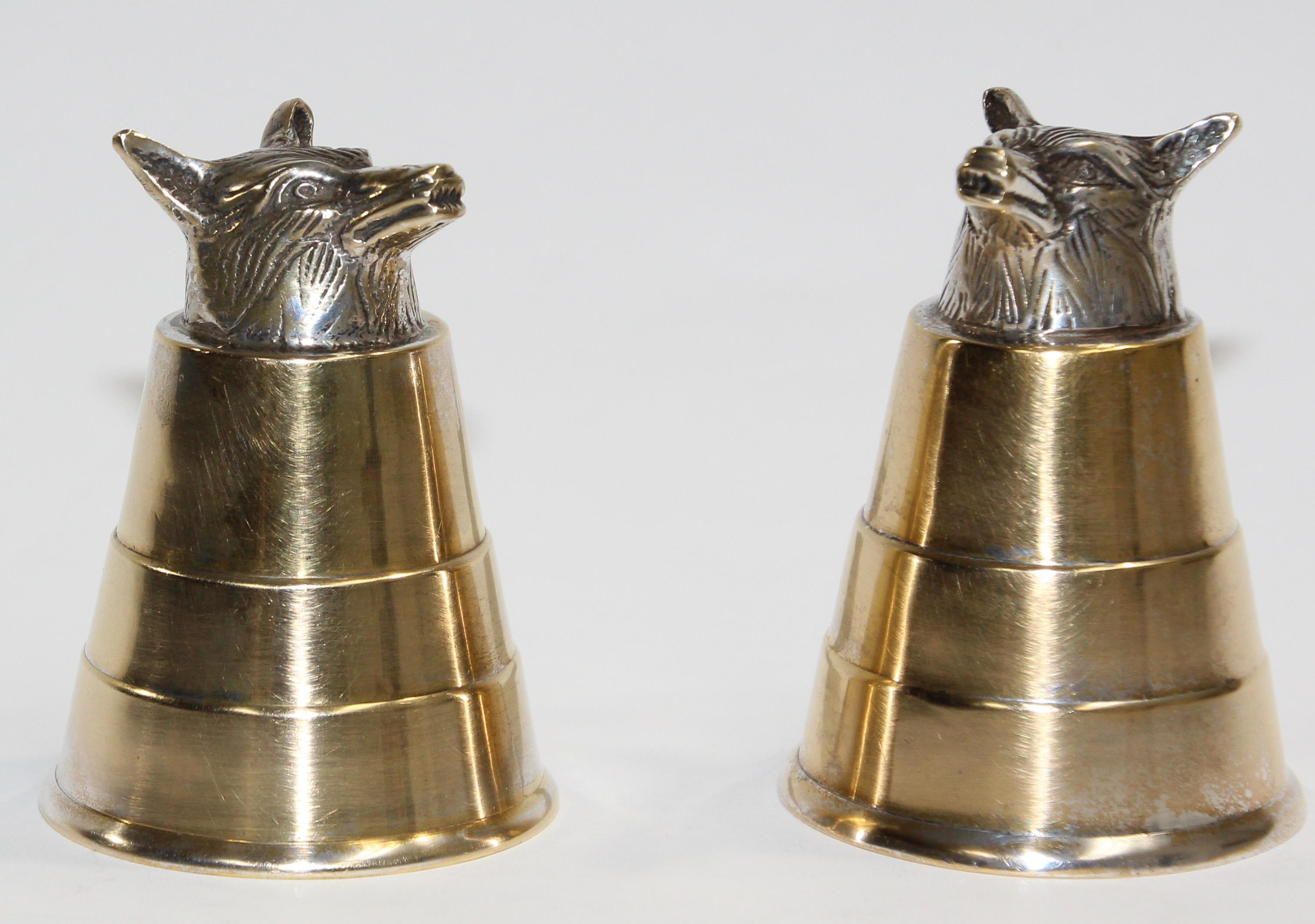 Classic Elizabeth II style stirrup cups, is of plain beaker form with a cast foxes head to one end.
Set of two playful stirrup cups from the 1970s.
Gorgeous stirrup cup adorned with a hand-carved fox head on its base.
They balance with the animal
