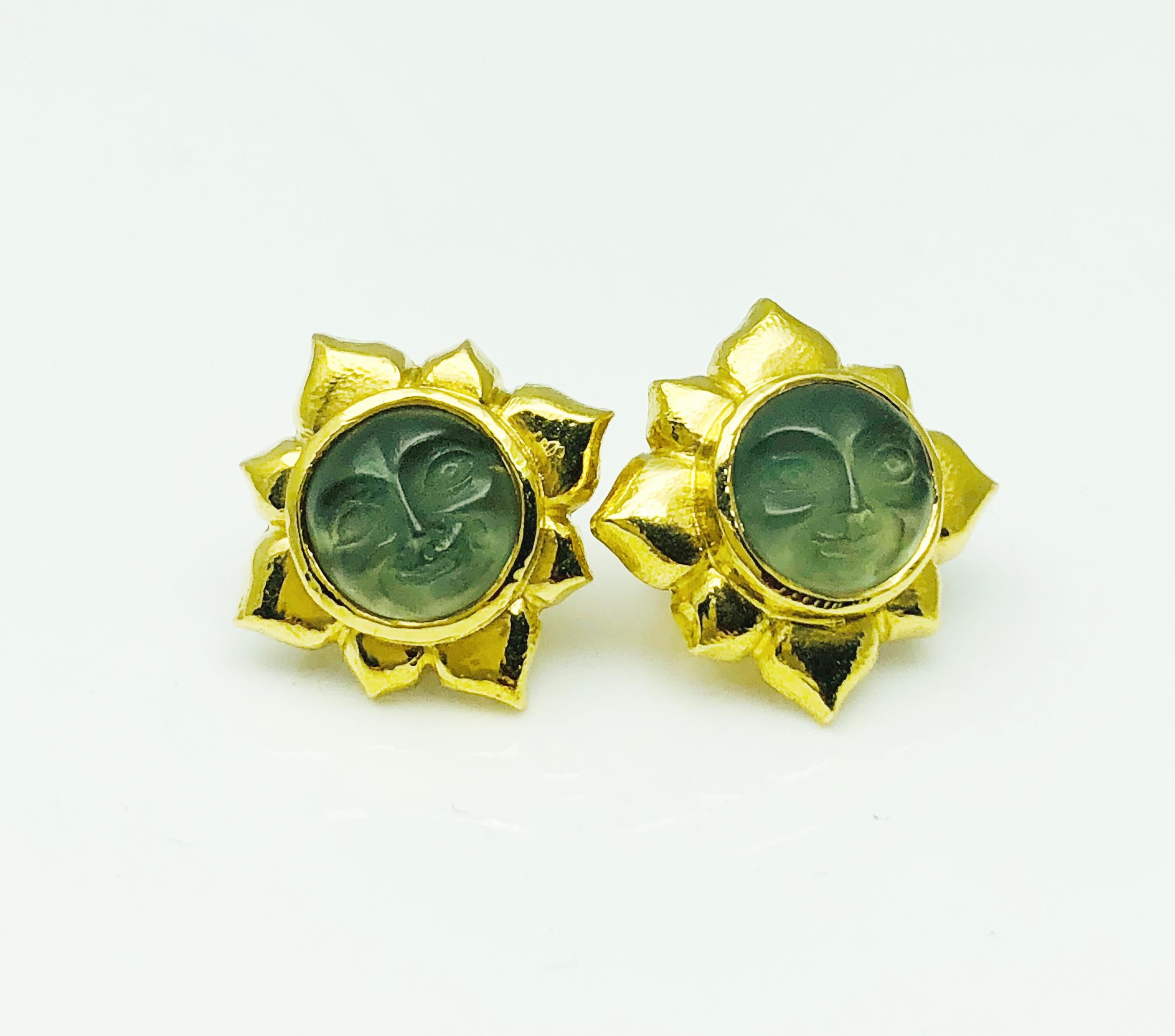 This is a beautiful and whimsical pair of earrings! Designed by Elizabeth Locke, this pair contains clear venetian glass, intaglio, bezel set, man in the moon face in an 18K Yellow gold setting with a gorgeous hammered finish. This pair can be