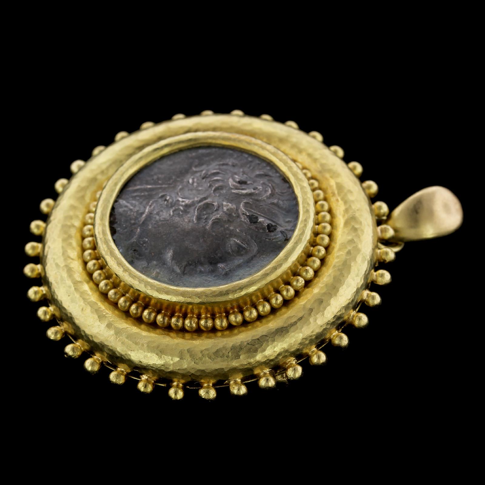 Elizabeth Locke 18K Yellow Gold Ancient Coin Pendant Brooch. The pendant is set with an ancient coin measuring 25.00mm., framed by hammered gold and beaded accents, diameter 1 3/4