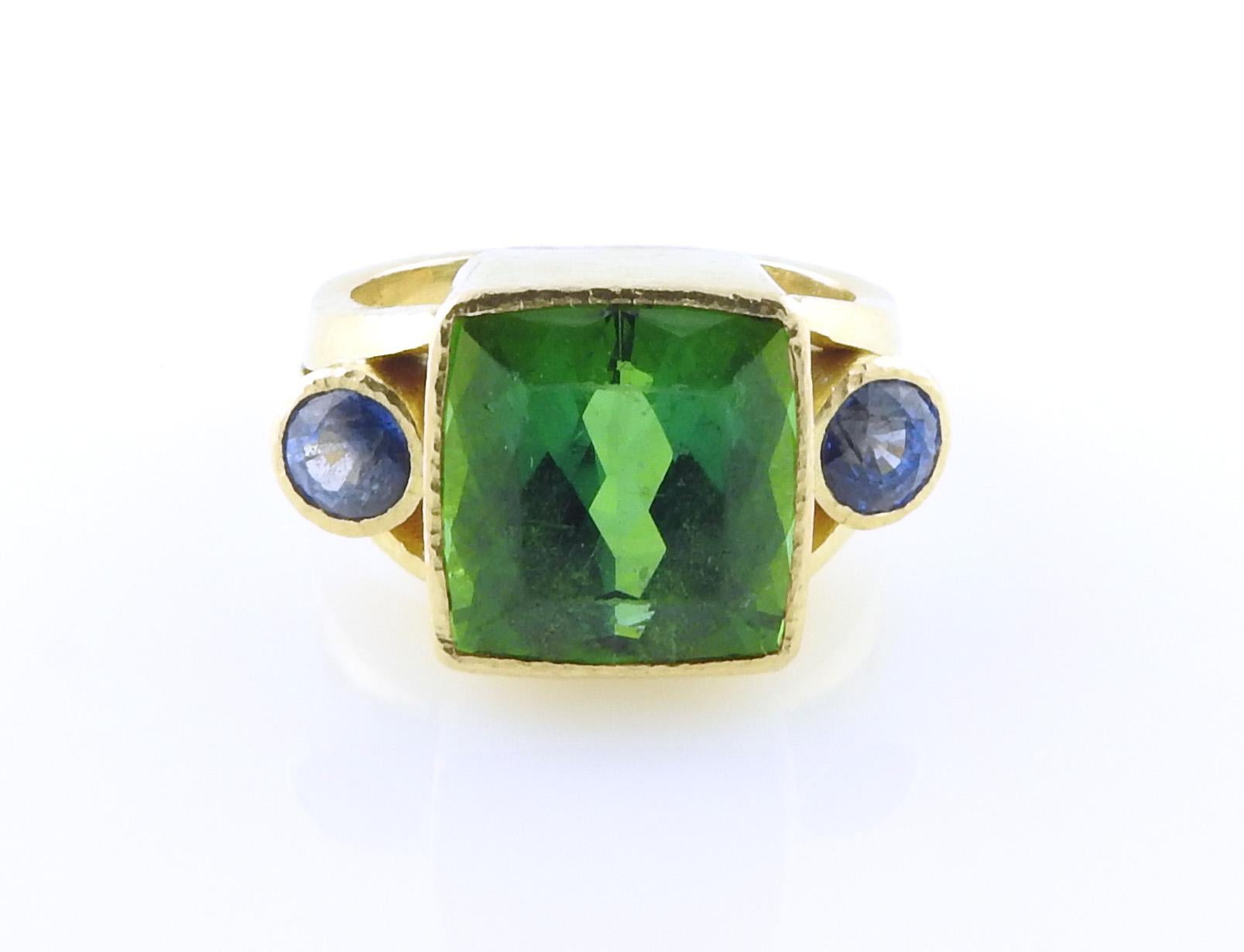 Elizabeth Locke 18K Gold Cocktail Ring

This beautiful Elizabeth Locke ring is set in 18K Hammered yellow Gold

Center stone is a faceted green tourmaline. Stone is approx. 10.7mm x 10.1mm. There are multiple nicks and scratches to this stone, noted