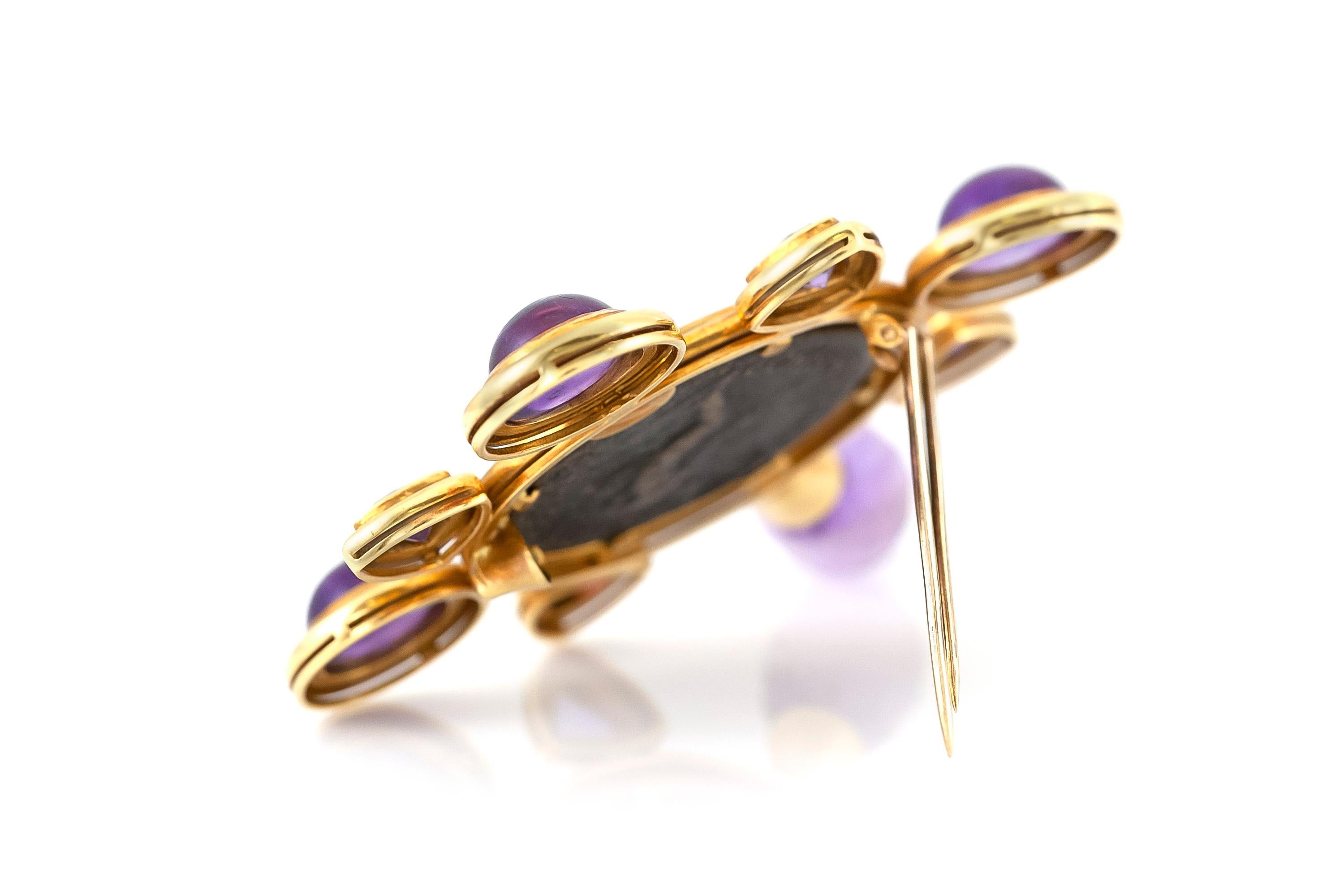 The pin is finely crafted in 18k yellow gold with amethyst around in different sizes .
The pin weighing approximately total of 29.7 dwt.
Circa 1920.