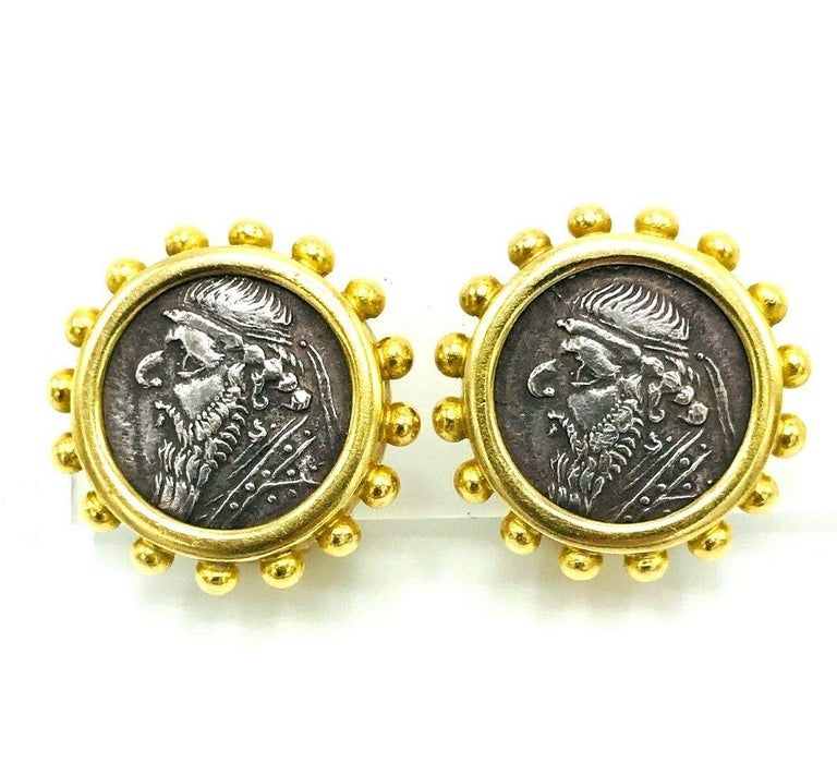 Modern 18k yellow gold and ancient coin earrings by Elizabeth Locke. They are earclips with hinged clip closures. Stamped with Elizabeth Locke maker's mark and a hallmark for 18k gold. 
Measurements: diameter is 7/8