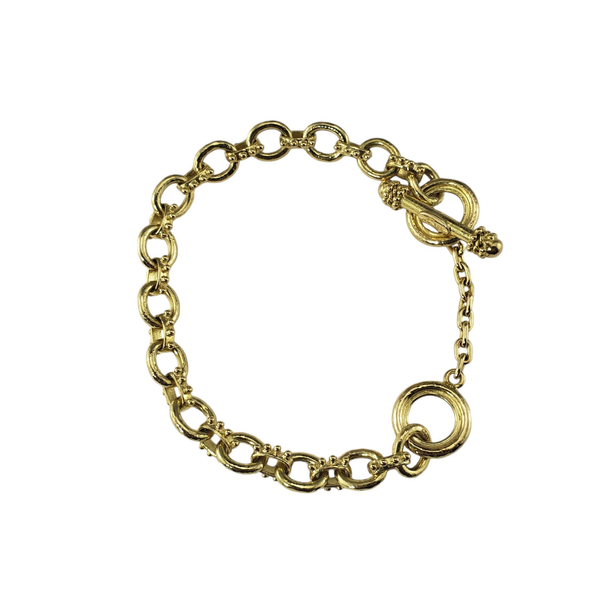 Bracelet à breloques en or jaune 18K d'Elizabeth Locke -

Ce superbe bracelet à breloques d'Elizabeth Locke est réalisé en or jaune 18 carats aux détails minutieux.  Fermeture à glissière.  

Largeur : 8 mm.

Estampillé : 18K

Taille : 8.25