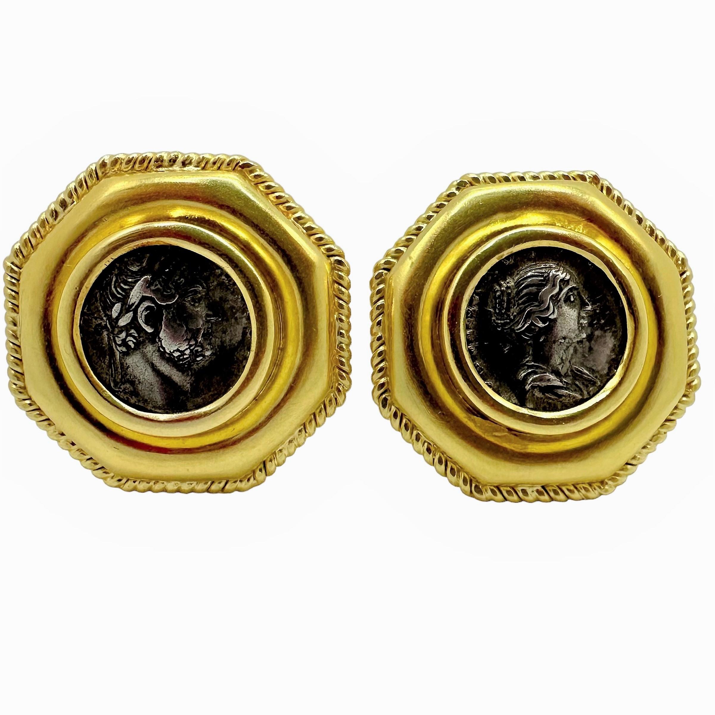 This exquisite pair of Elizabeth Locke designer earrings are set with one ancient silver, Roman Empire period coin in each. Both antiquities are set at the center of  rope edge octagonal 18K yellow gold frames, measuring 1 3/16 inches in diameter. A