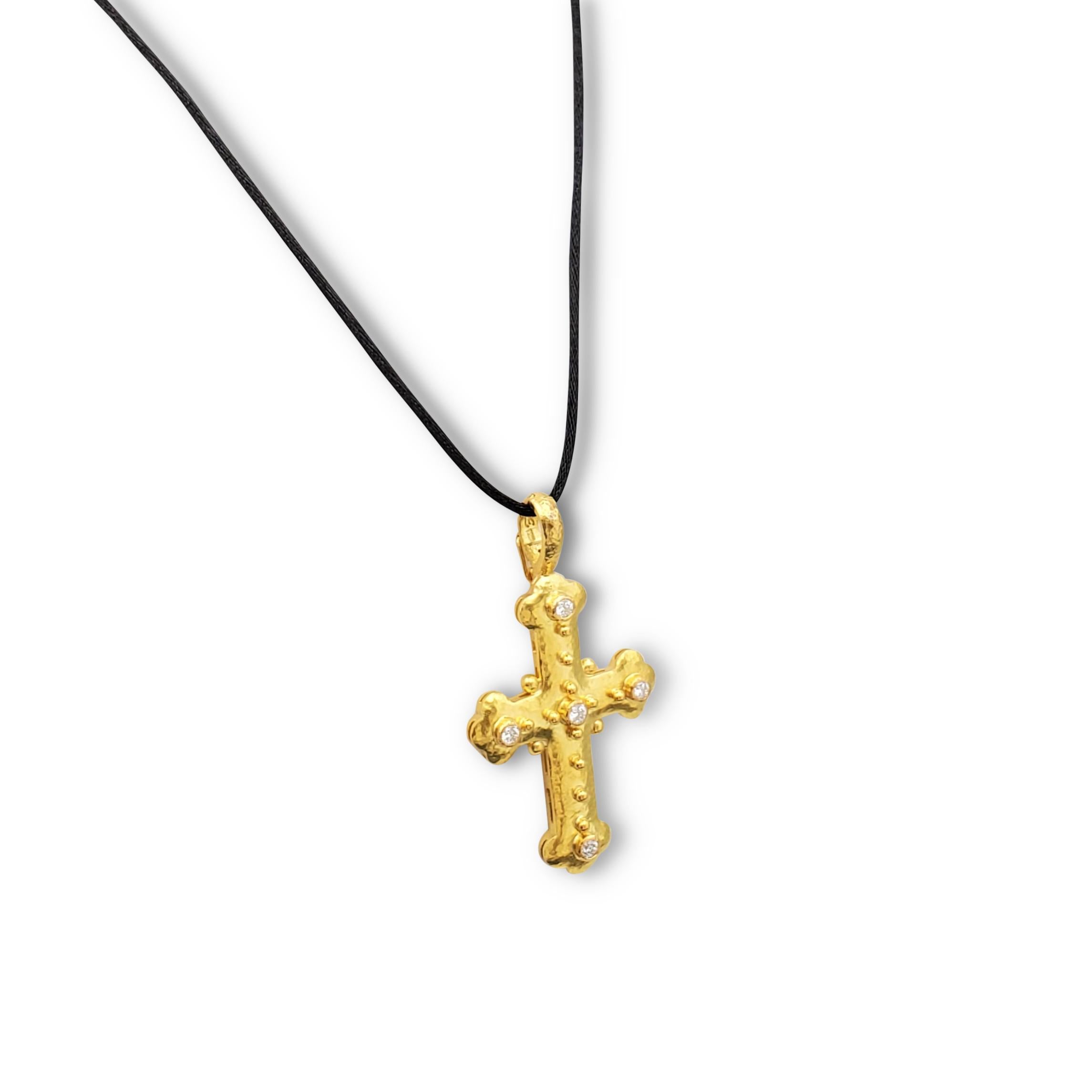 Authentic Elizabeth Locke cross pendant crafted in gleaming 19 karat hammered gold and set with an estimated 0.50 carats of round brilliant cut diamonds (E-F color, VS clarity). Signed EL, 19K. The pendant is suspended from a black silk chain that