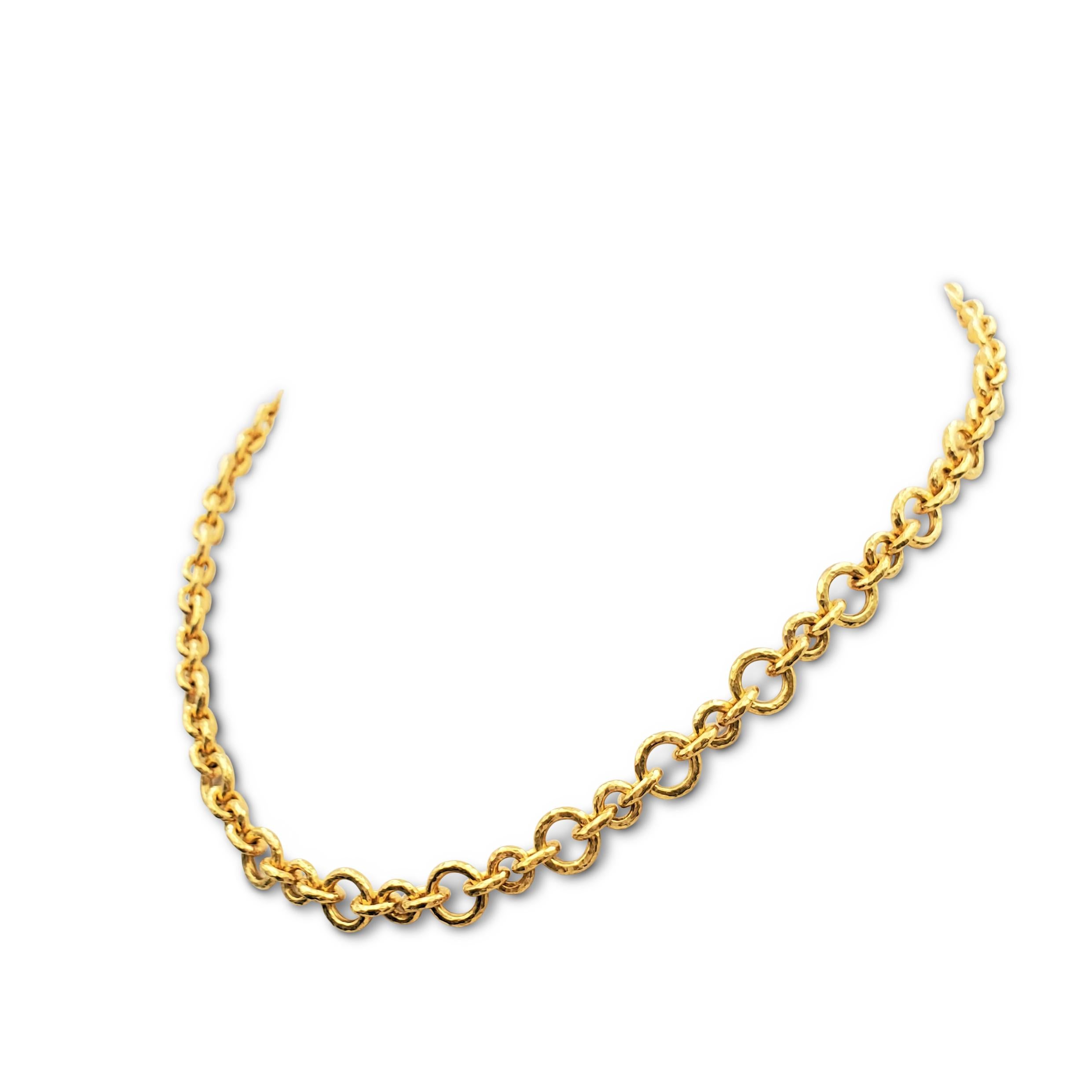 Authentic Elizabeth Locke necklace crafted in lustrous hammered 19 karat gold is comprised of interlocking round links. Granulated end-caps detail the toggle closure. Signed EL, 19K. The necklace measures 17 inches in length. Not presented with the