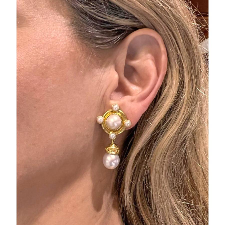 These elegant Elizabeth Locke pendant earrings feature a surmount centering a 10mm mabe pearl bordered by four 4mm half pearls at the cardinal points, all bezel-set in lustrous 19k yellow gold. The detachable drops showcase an Etruscan-style beaded