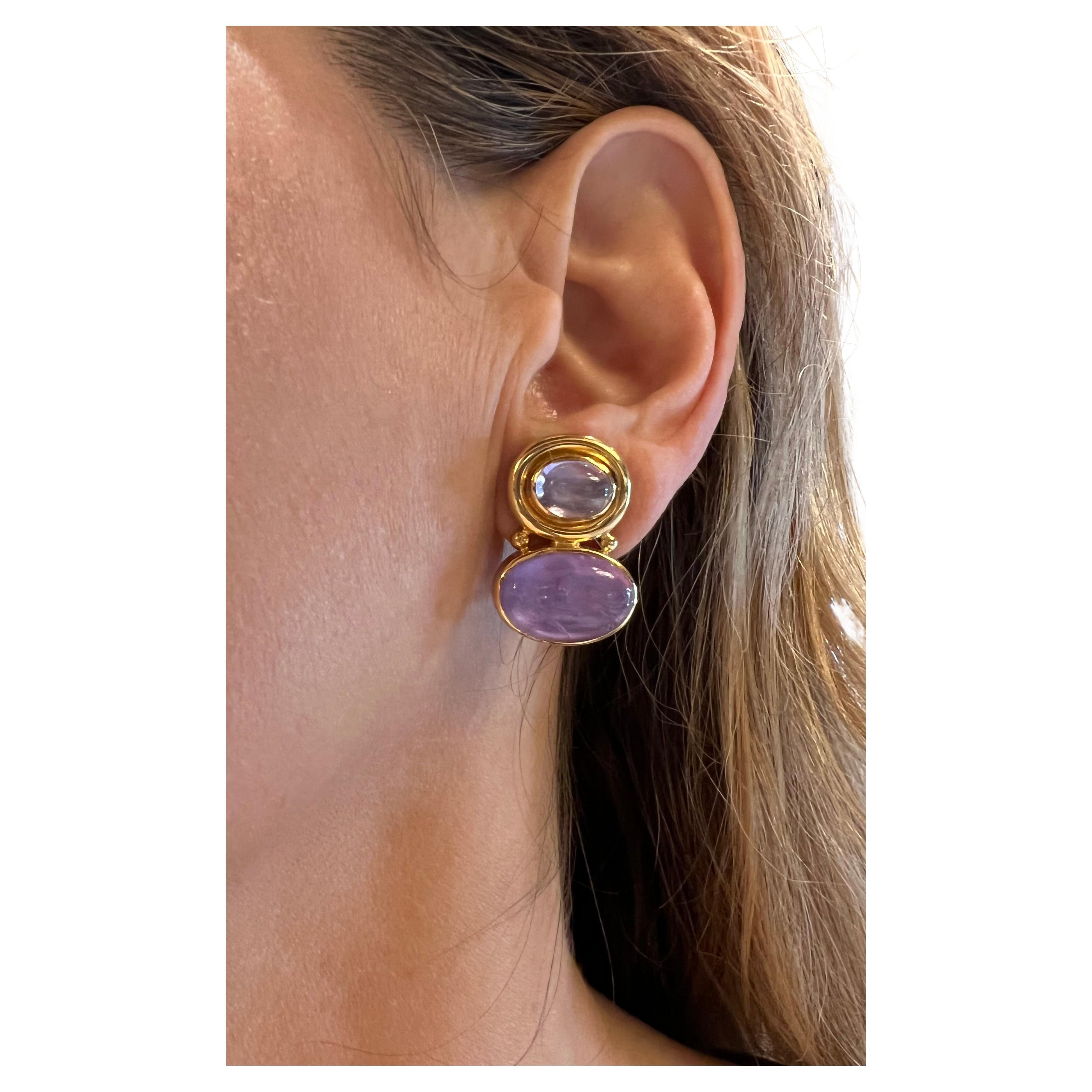Venetian glass intaglio earrings in 19k yellow gold, the top is set with a polished, light purple Venetian glass cabochon and the bottoms are set with purple oval, carved intaglios, with mother-of-pearl on the reverse side. Pierced, fold down hinged