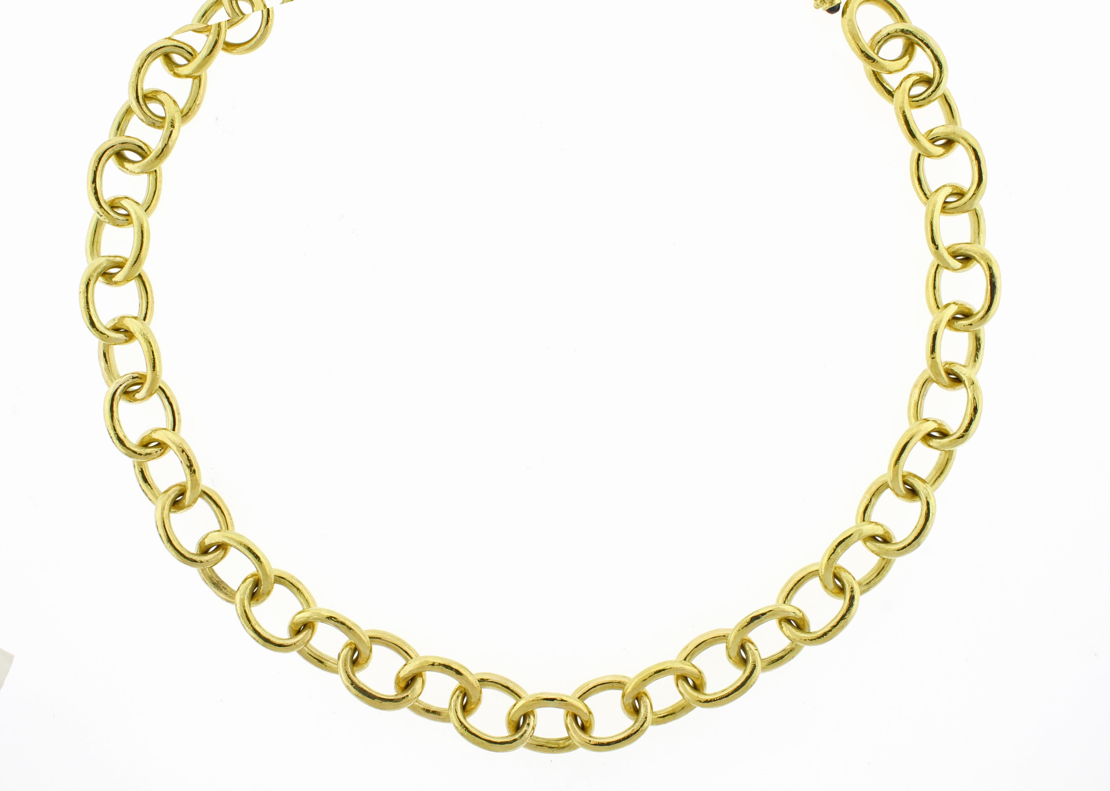 Adorn your neckline with this stunning necklace from Elizabeth Locke, featuring hammered 19kt yellow gold oval links.  This piece is secured with a toggle closure and finished cabochon gemstones at the end caps, providing a blend of classic elegance