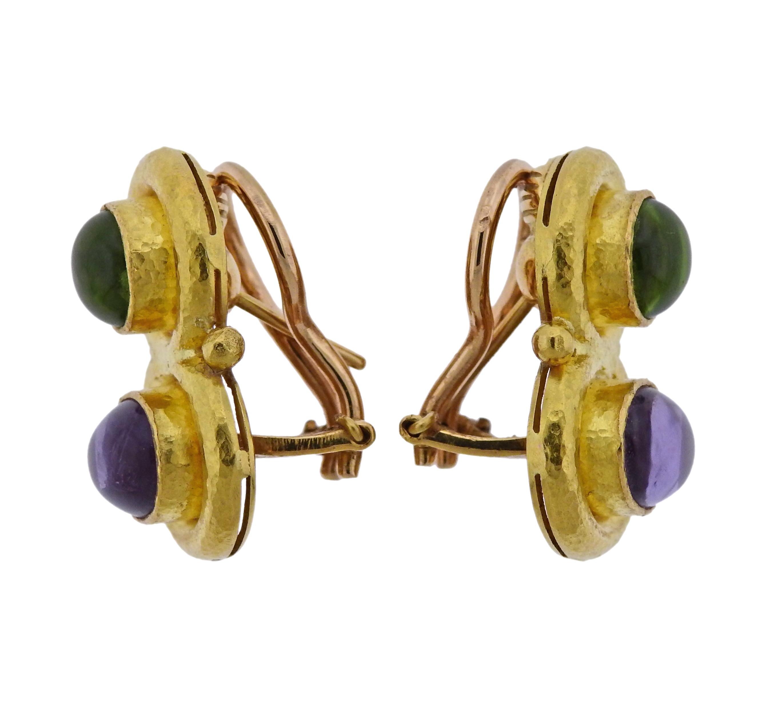 Pair of 19k gold earrings, crafted by Elizabeth Locke, set with amethyst and peridot cabochons, backed with mother of pearl.  Earrings are 23mm x 15mm, with collapsible posts, weigh 16.2 grams. Marked: E hallmark, 19k.