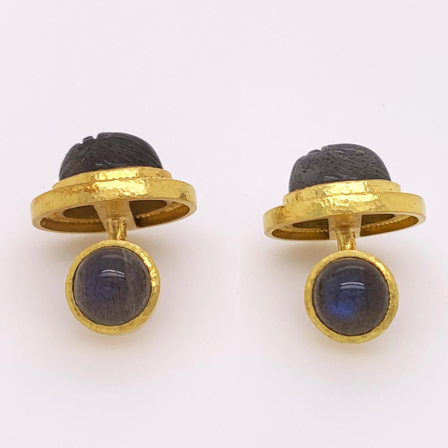 These Elizabeth Locke cufflinks feature 2 oval pieces of cabochon labradorite carved into scarabs, as well as 2 pieces of round cabochon labradorite bezel set in 19k yellow gold.

0.75