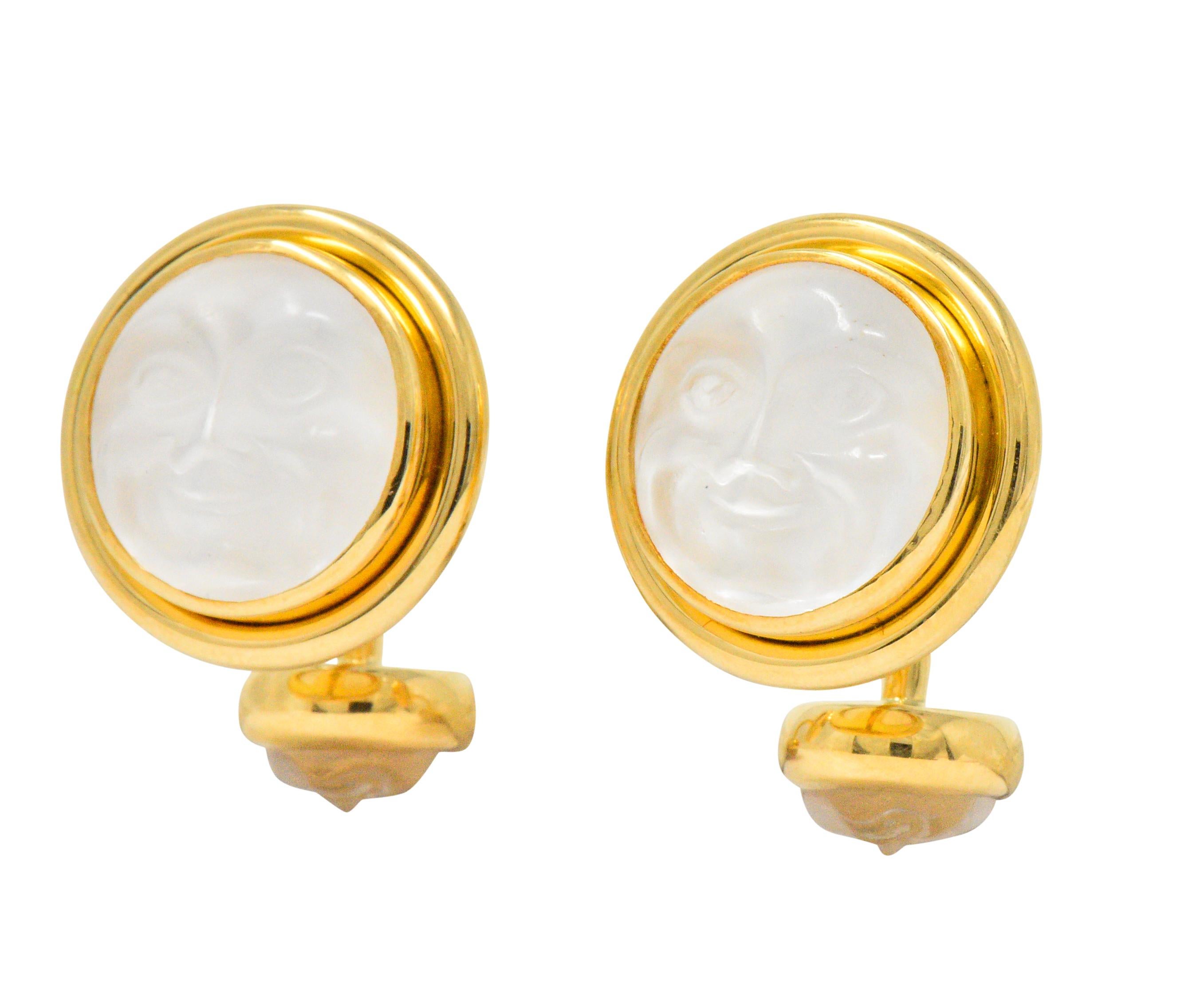 Fixed back style cufflinks with each circular end bezel set with rock crystal backed by iridescent mother-of-pearl

Translucent white in color and deeply carved to depict man-in-the-moon motif

Maker's mark for Elizabeth Locke

Stamped 18K for 18