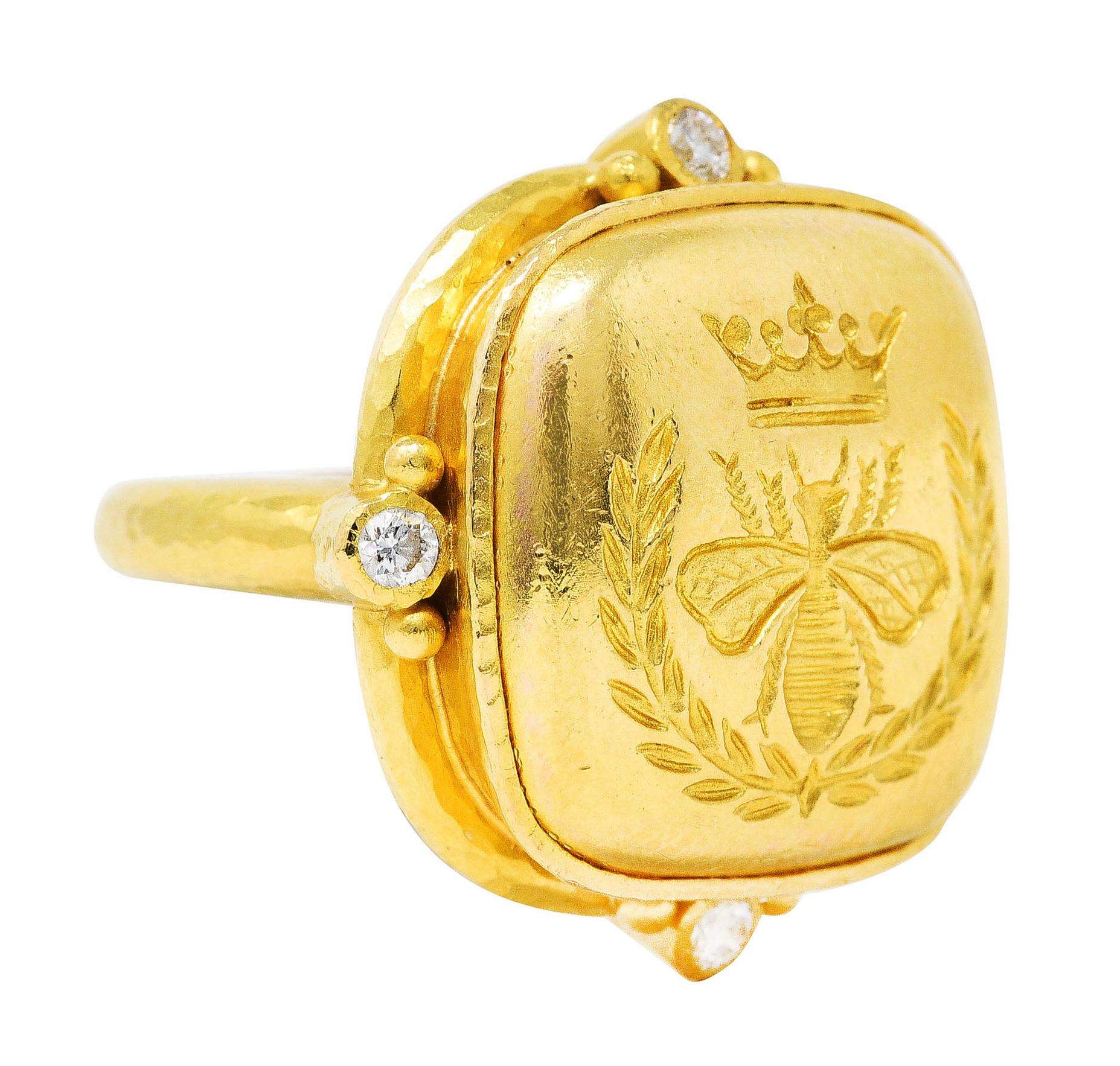 Ring designed with square cushion shaped head with hammered gold texture throughout

Centering a gold cushion cabochon engraved with bee crown and laurel

Featuring gold beading and bezel set diamonds at cardinal points

Diamonds are eye clean and