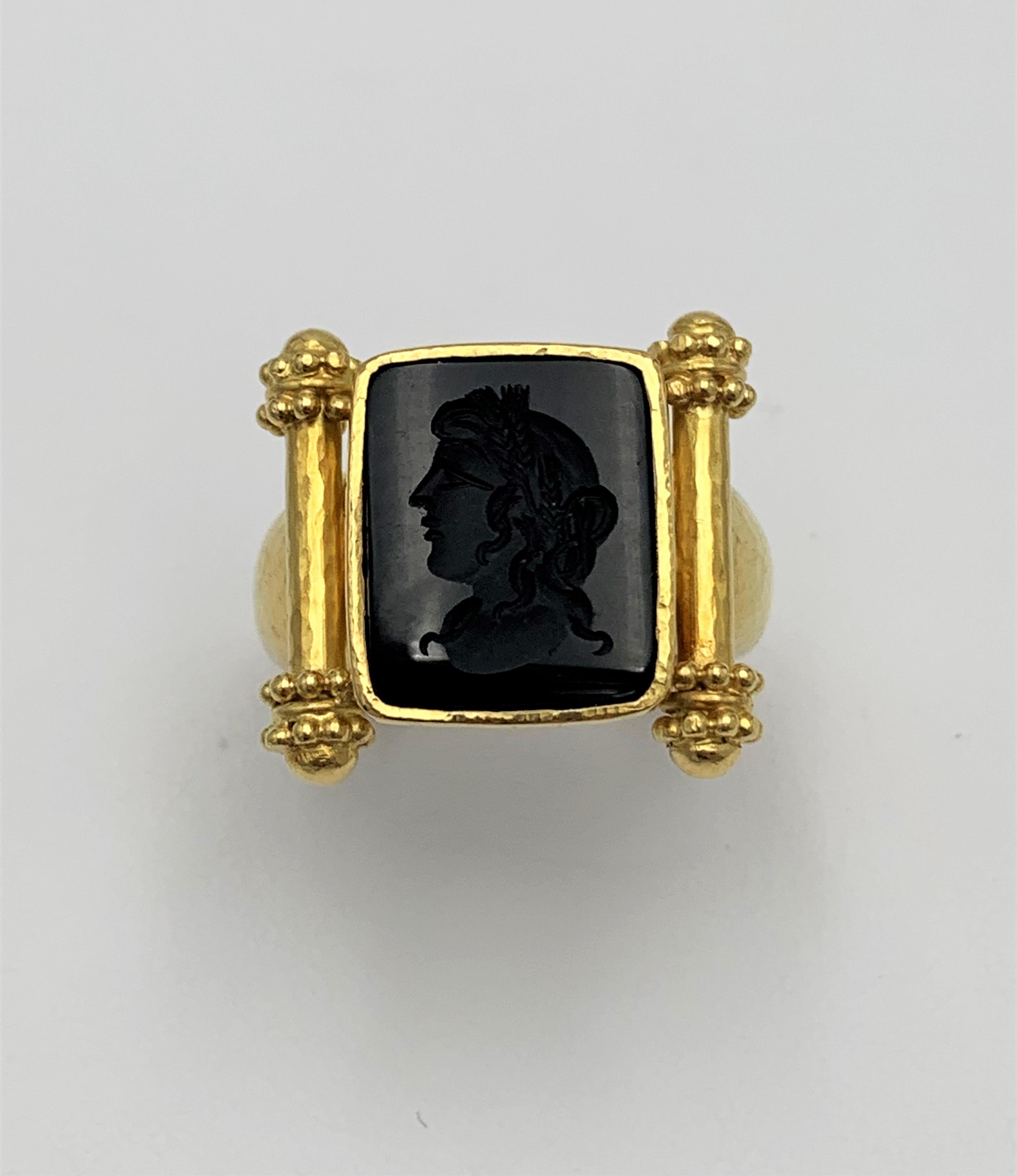 Authentic Elizabeth Locke ring crafted in 19 karat gold centers on an intaglio carved onyx stone. Ring size 10. Not presented with original box or papers. CIRCA 2010s.