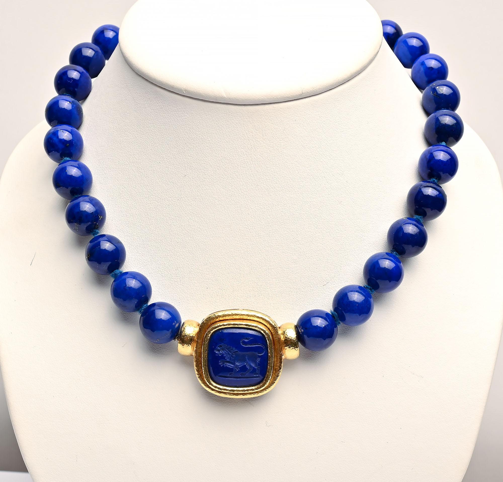 Stunning Elizabeth Locke  necklace with brilliantly colored lapis lazuli beads that measure about 12.5 mm. . The clasp is a medallion with a lion. It can be interchanged with other Locke pendants. The necklace measures 18 inches including the