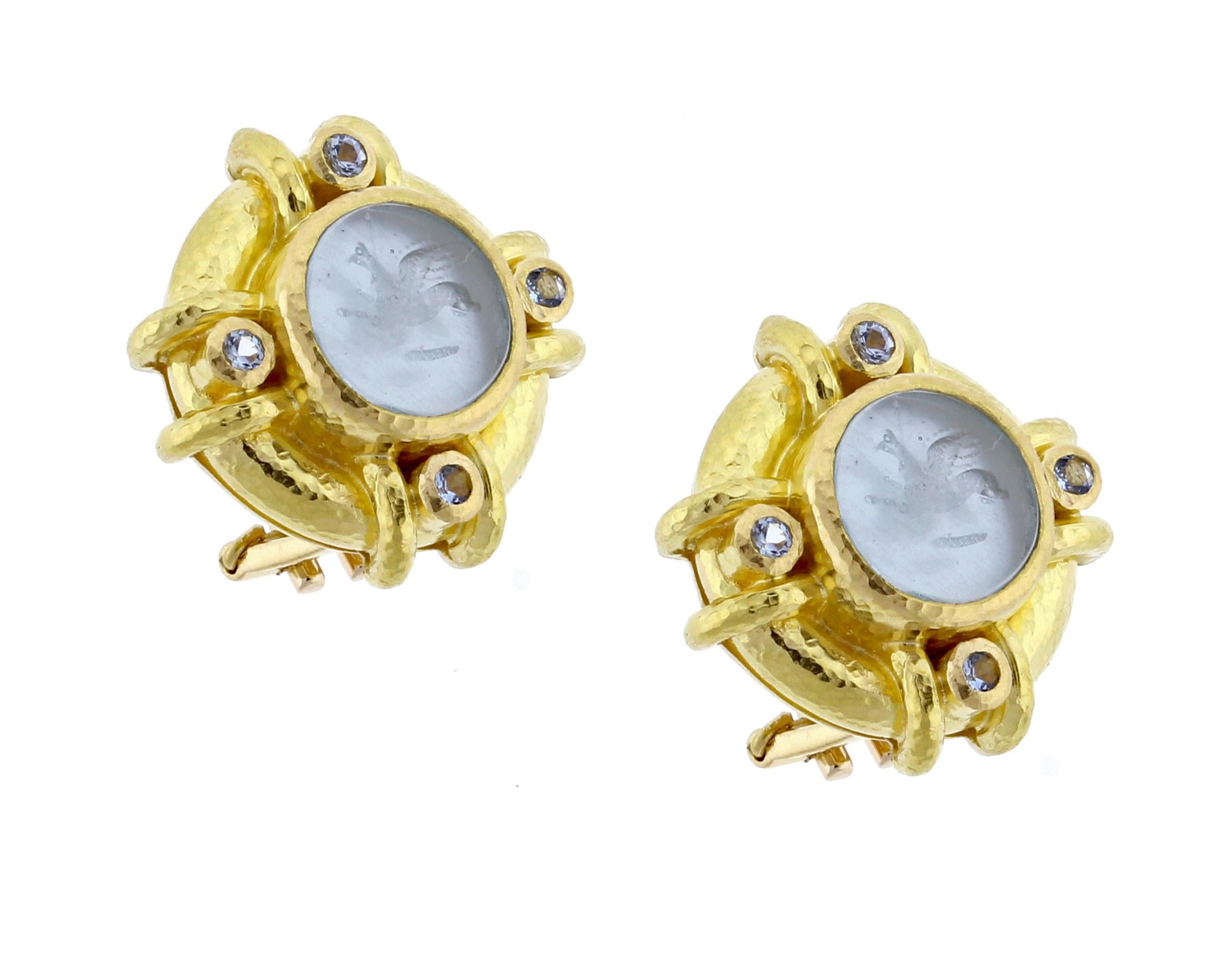 From  Elizabeth Locke, a pair of 19 Karat hammered gold earrings with a center Venetian glass intaglio with mother-of-pearl back. Intaglios made with modern glass using 17th century molds. Four faceted aquamarines.  Omega clip with fold-down post