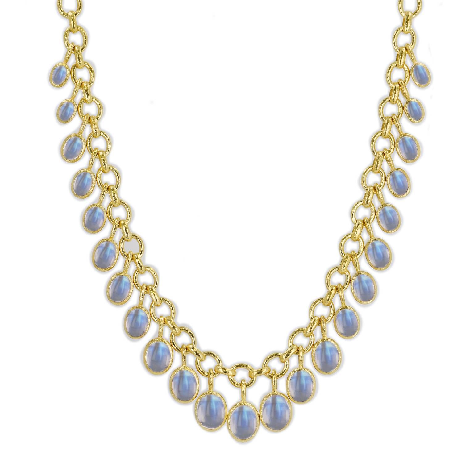 This previously loved 18 karat yellow gold Elizabeth Locke link necklace features twenty-four bezel-set oval-shaped moonstone cabochons and is versatile and chic. Make it your new favorite accessory.